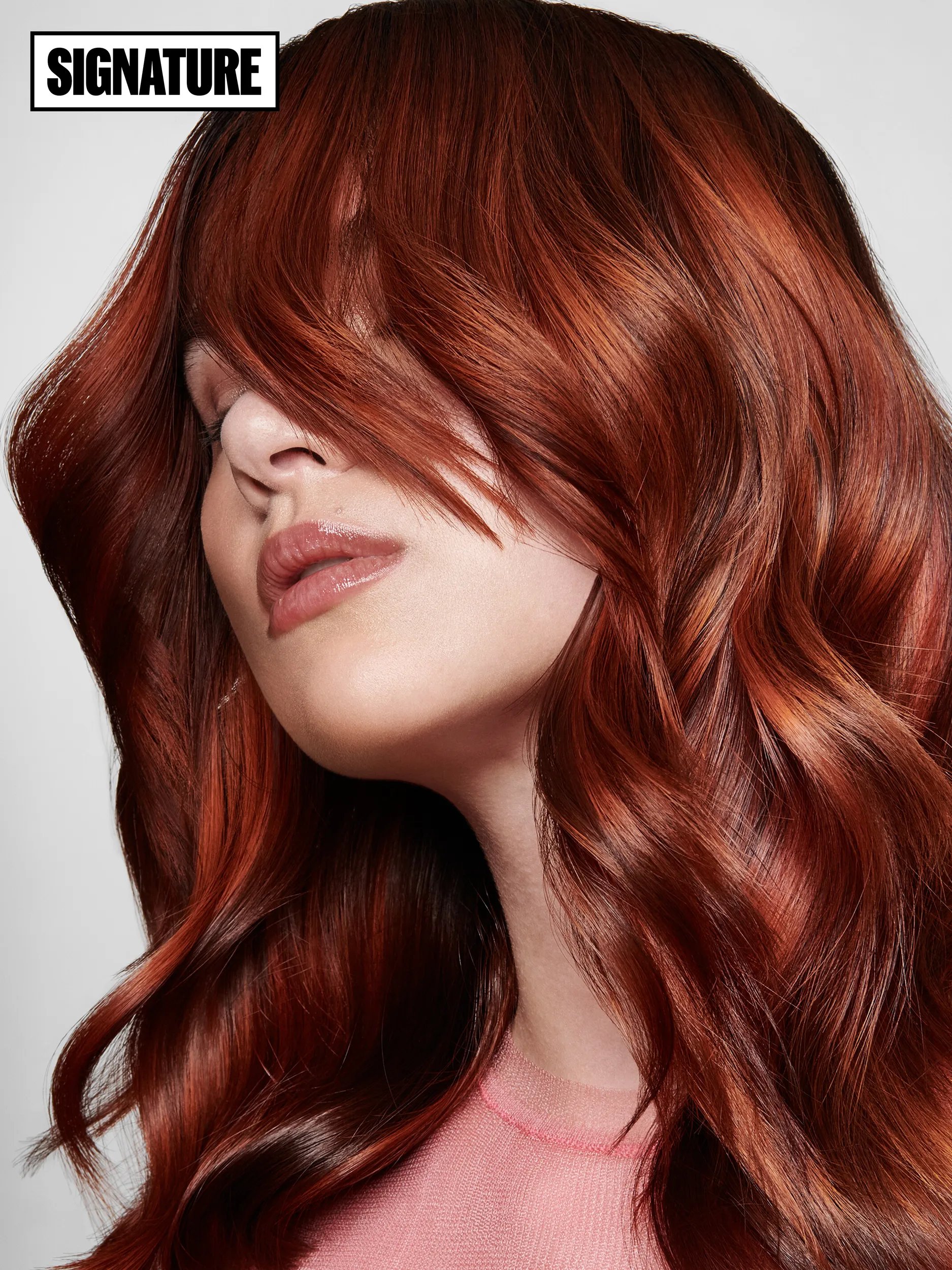 Close-up model with short red glass hair