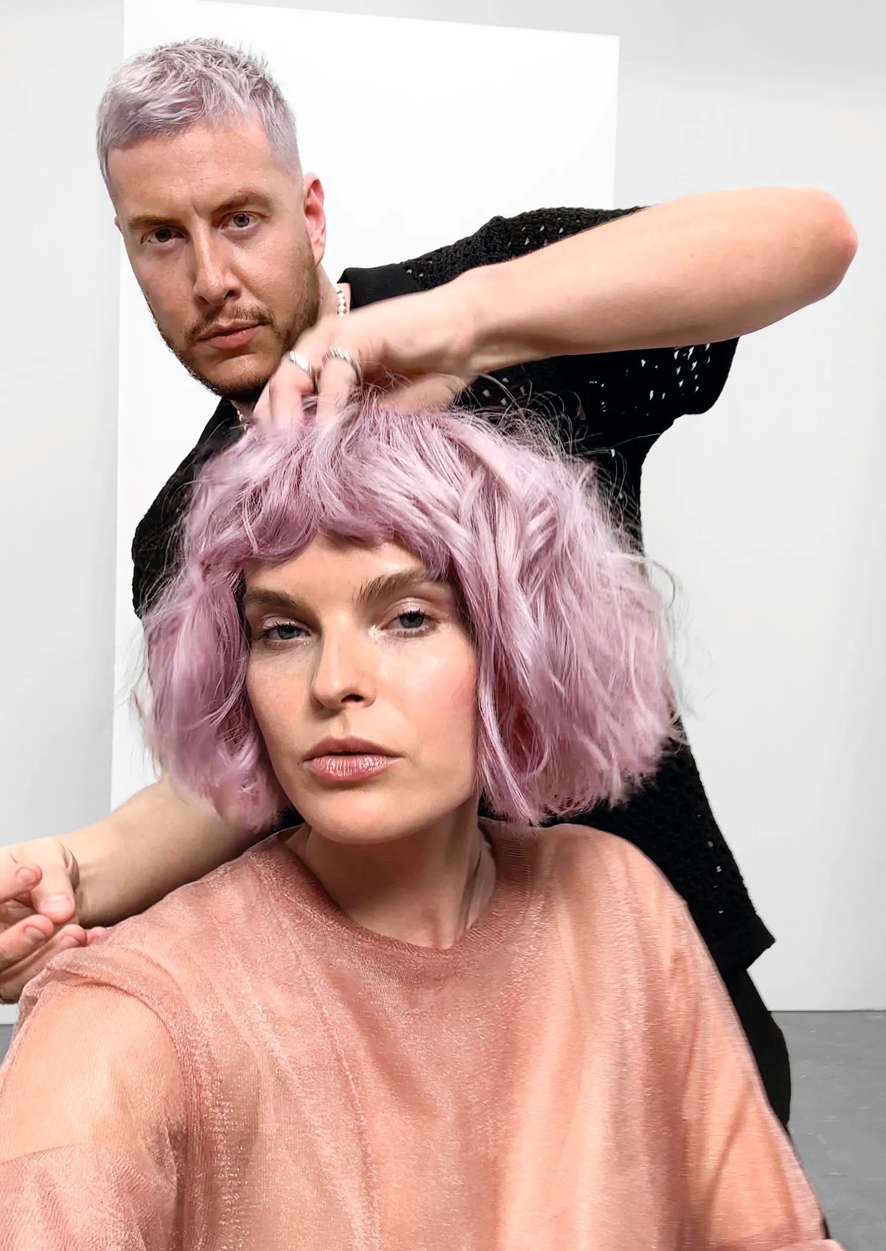 Power pair James Earnshaw and a model with pink short hair