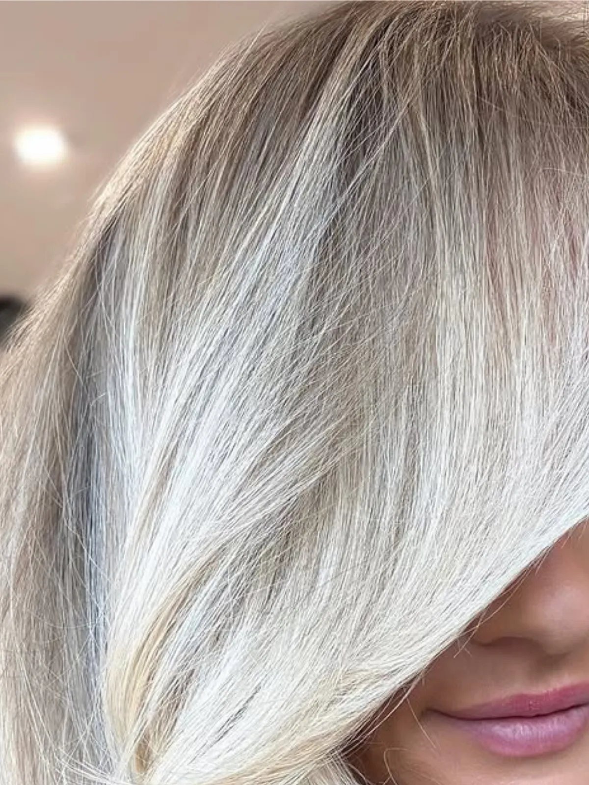 Close-up of model’s old money platinum blonde hair.