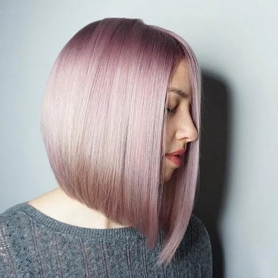 Woman with short, pink bob, created using Wella Professionals