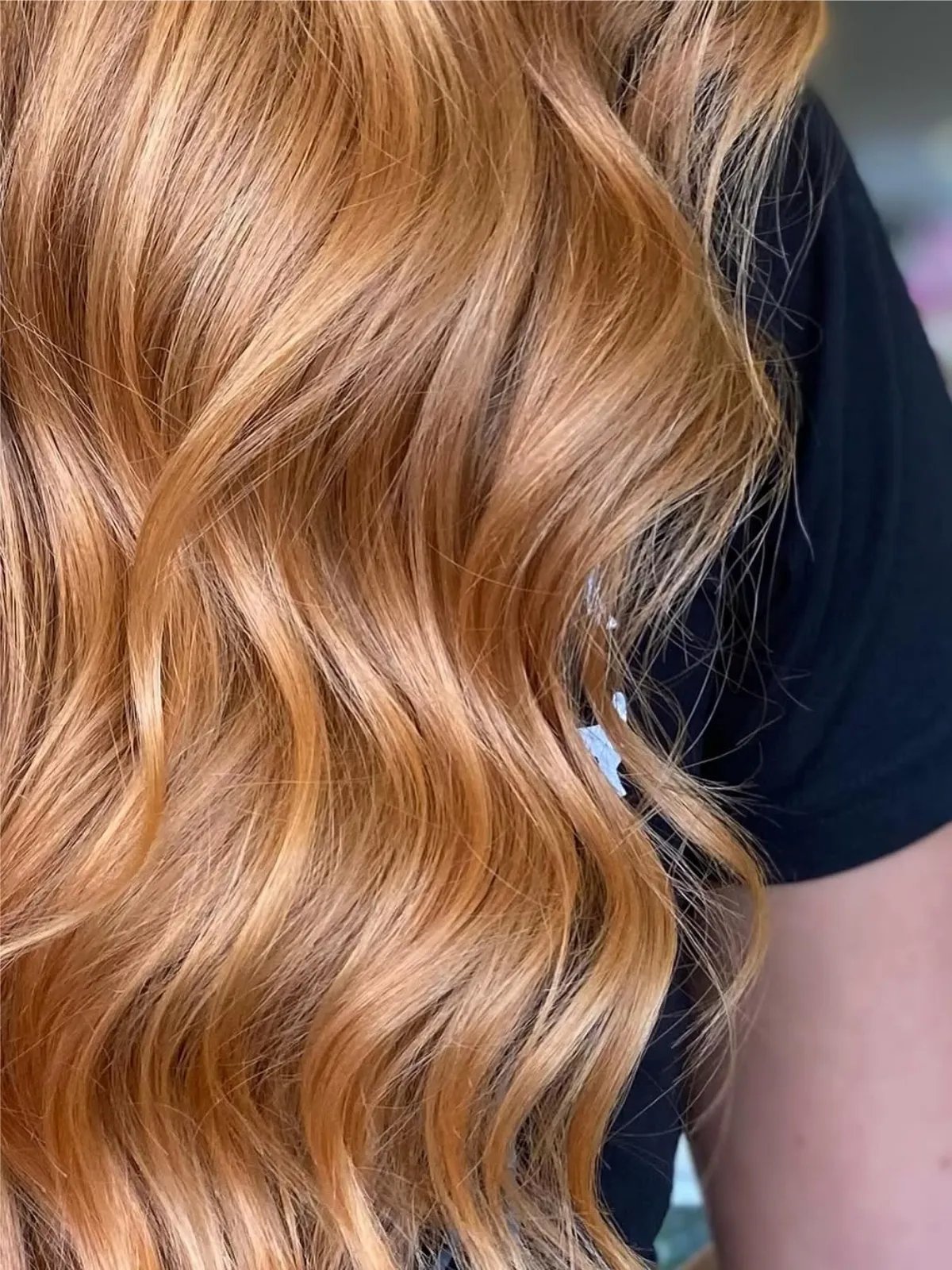 Close-up of model’s strawberry blonde hair.