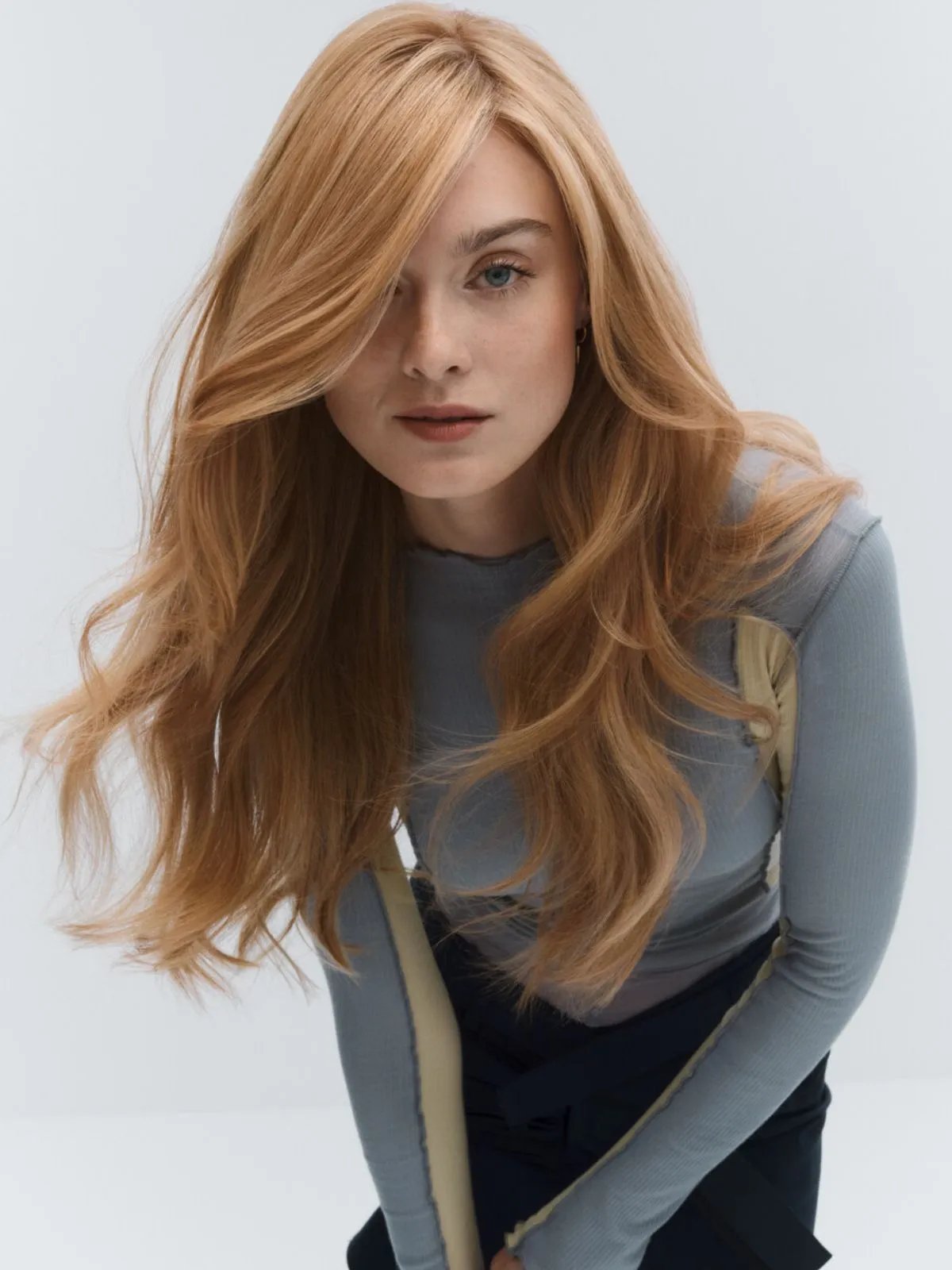 Model with long, loosely curled, golden blonde hair