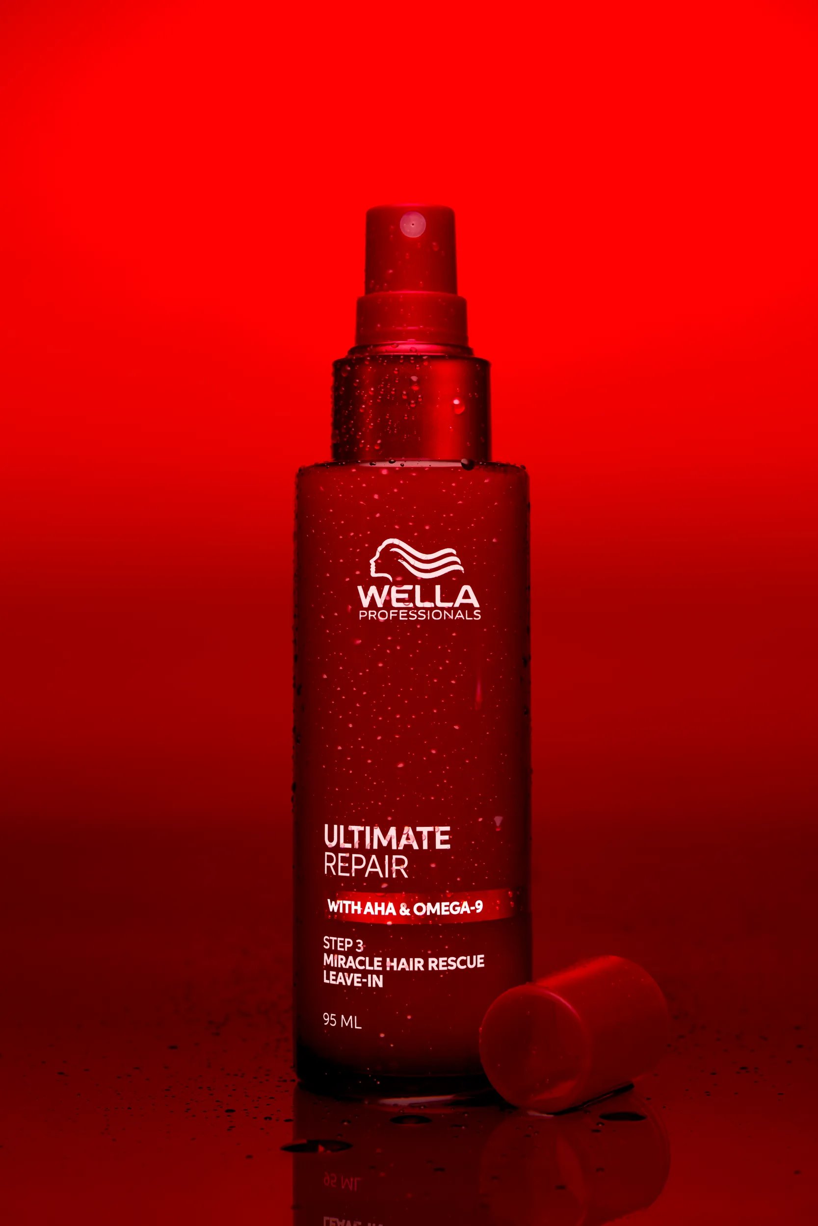 Packshot of Wella Ultimate Repair Miracle Hair Rescue Leave-in over a red background