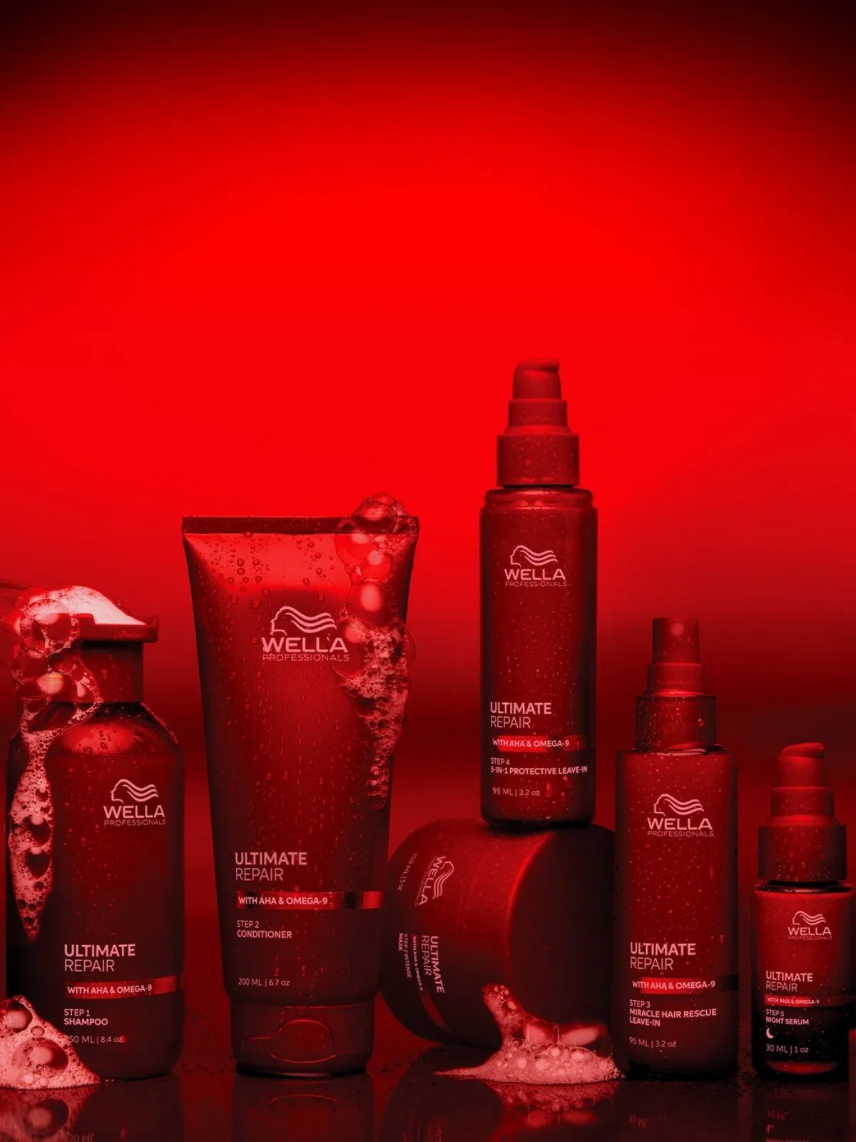 The ULTIMATE REPAIR haircare collection on a red background.