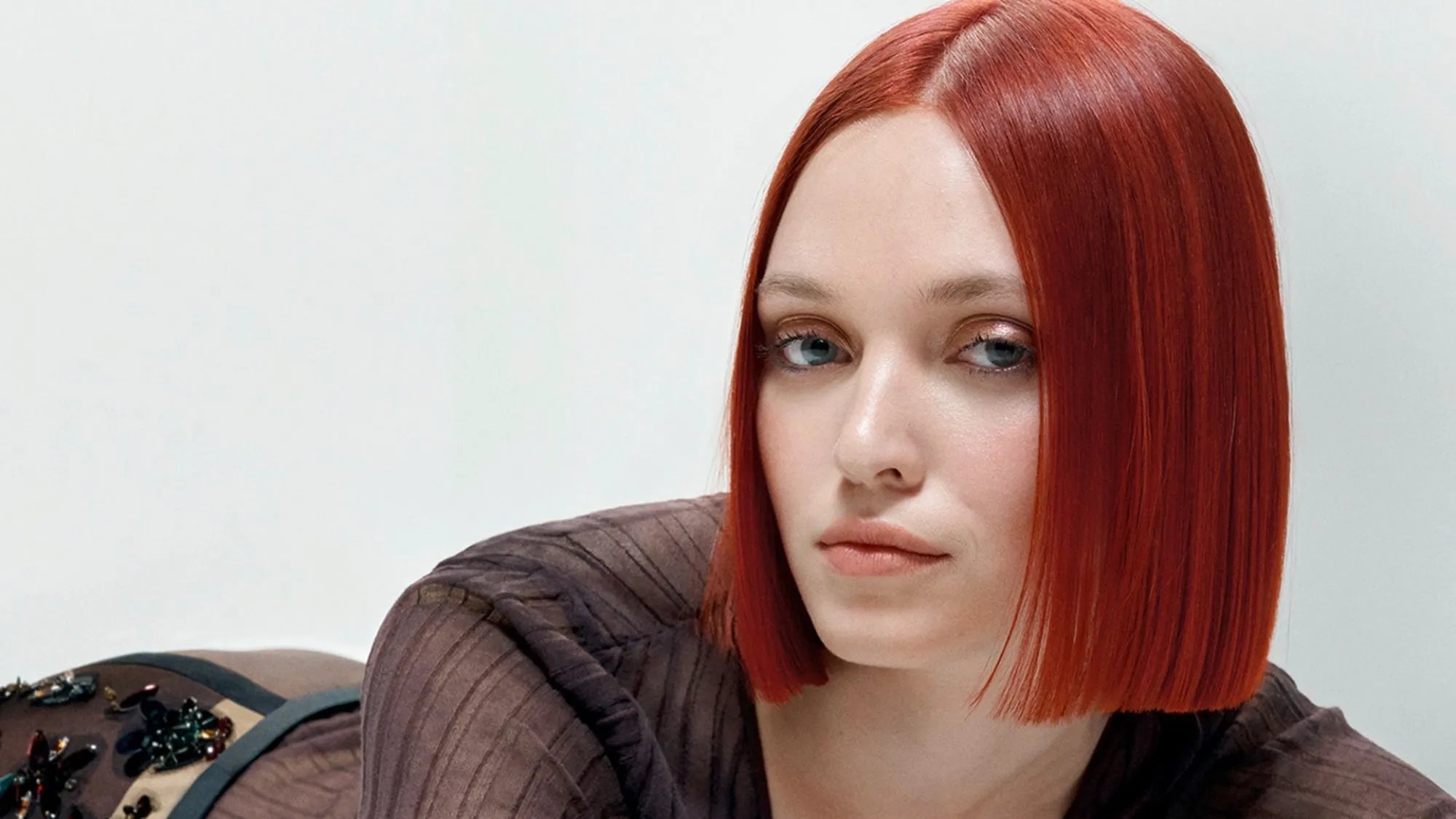 Model with bright red bob haircut. 