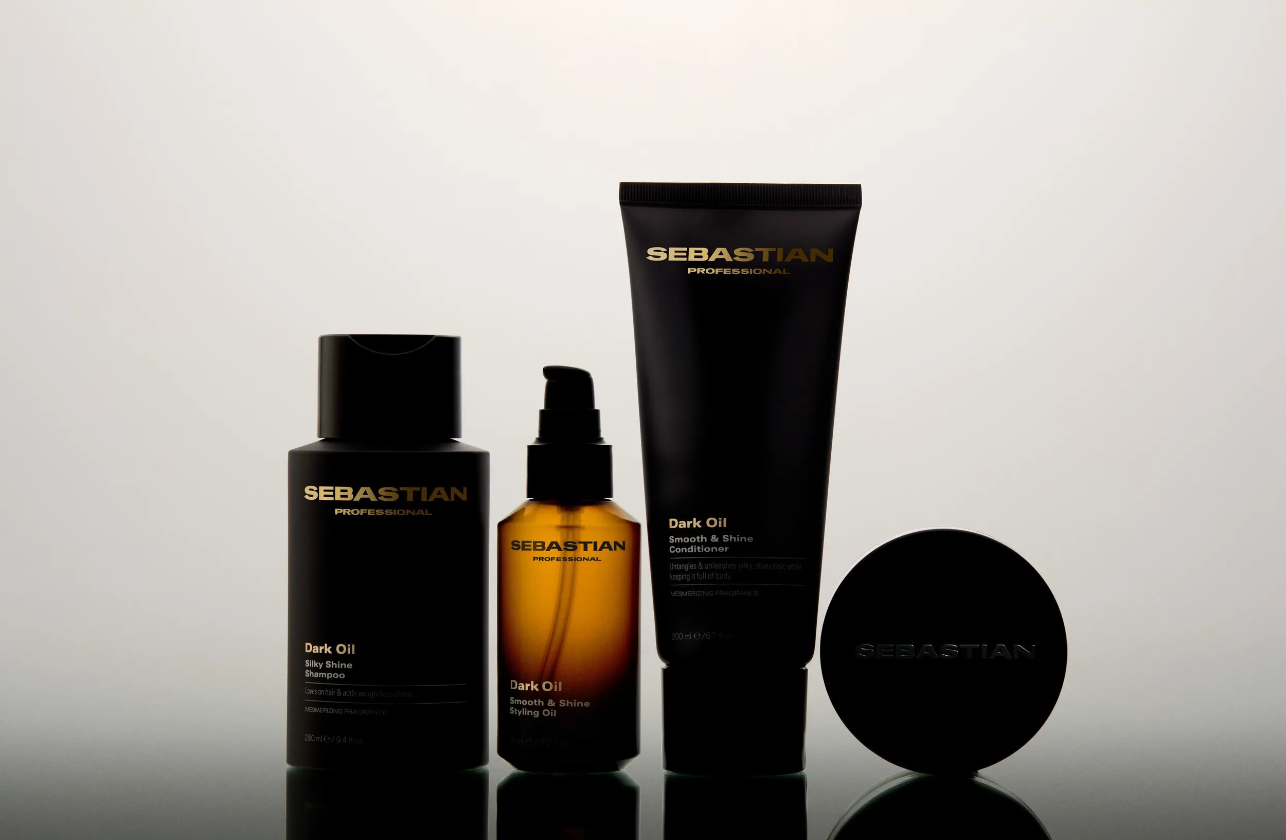 Product shot of Sebastian Dark Oil range against white background. 