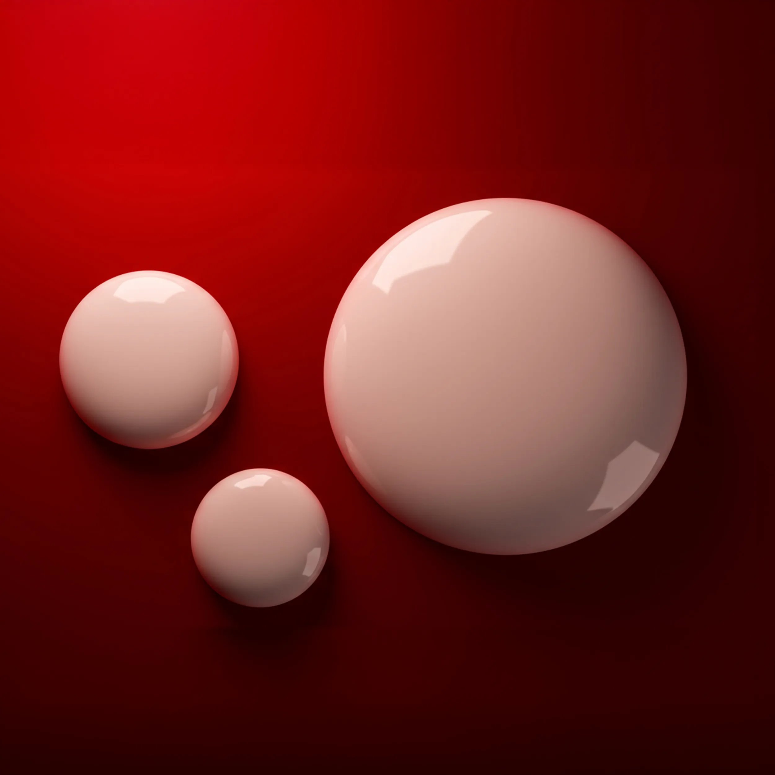 Close up of white droplets against red background.