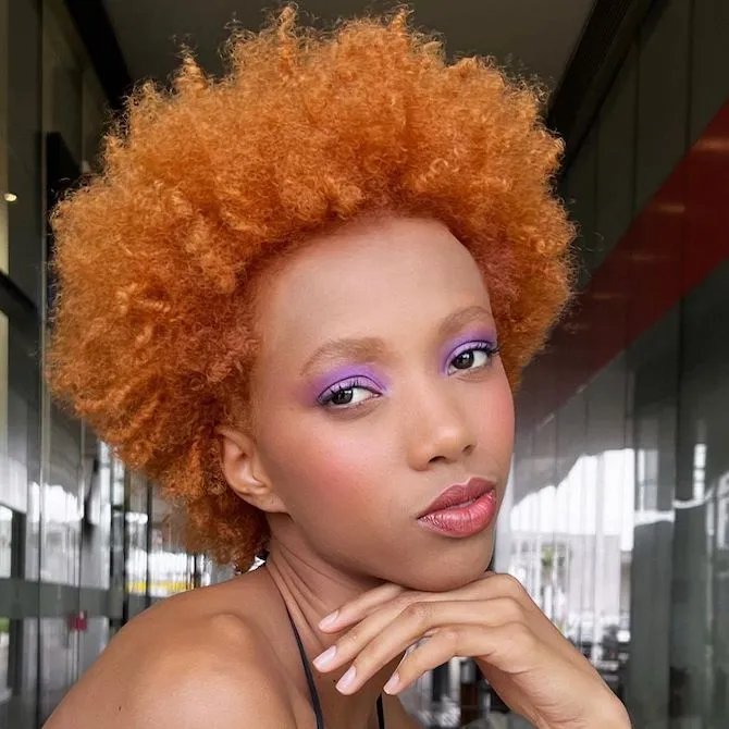 Model with red curly hair