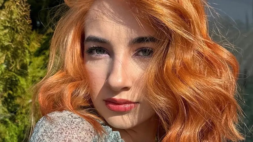 Golden copper blonde hair with a radiant, sunlit finish.