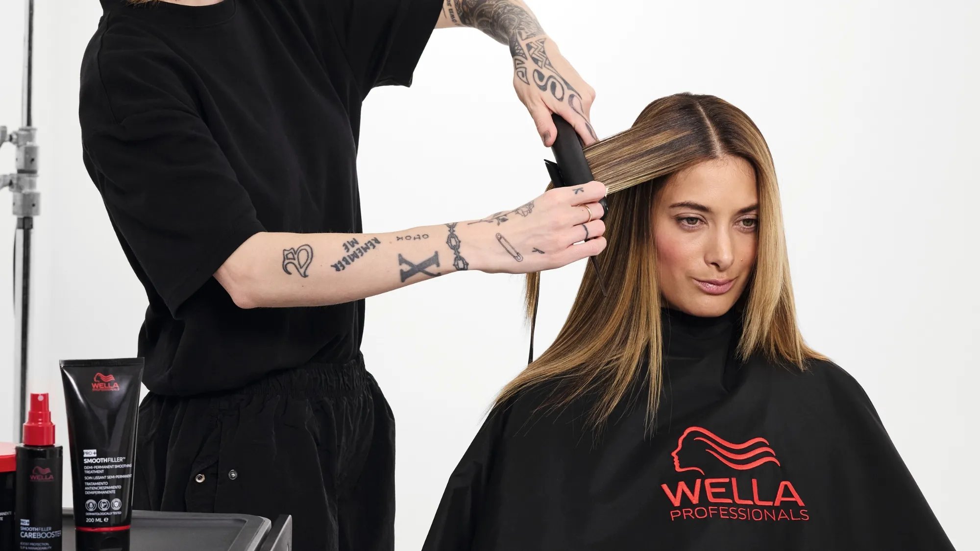 Model’s hair is flat ironed to activate the Smoothfiller treatment. 