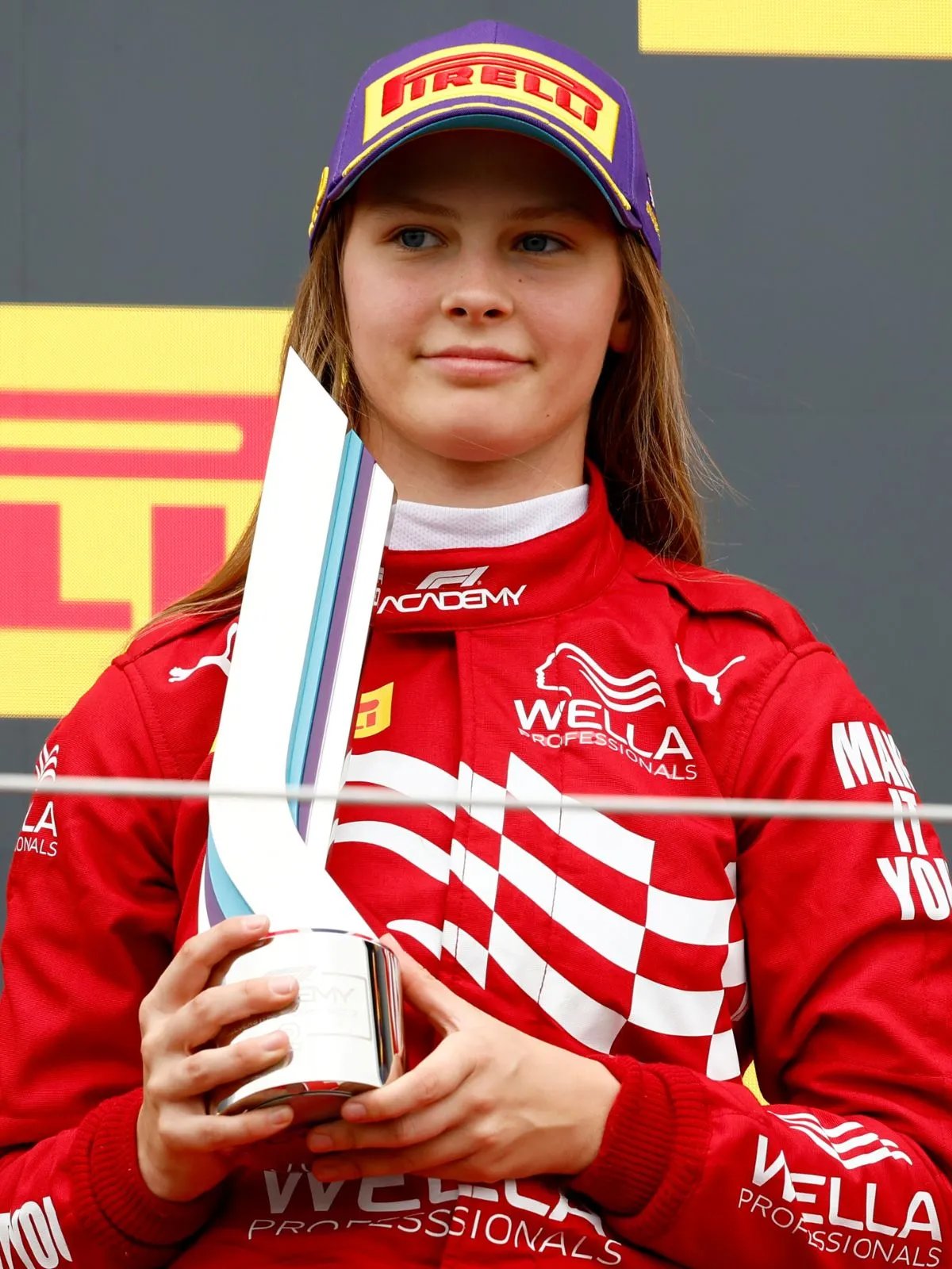 Chiara Bättig holds her trophy after achieving highest-ever finish by a Wild Card driver.
