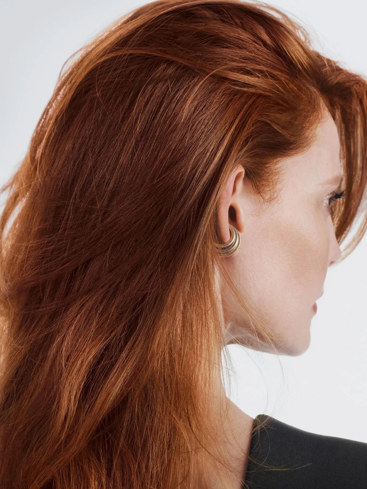 Model with smooth, glossy, apricot red hair color.