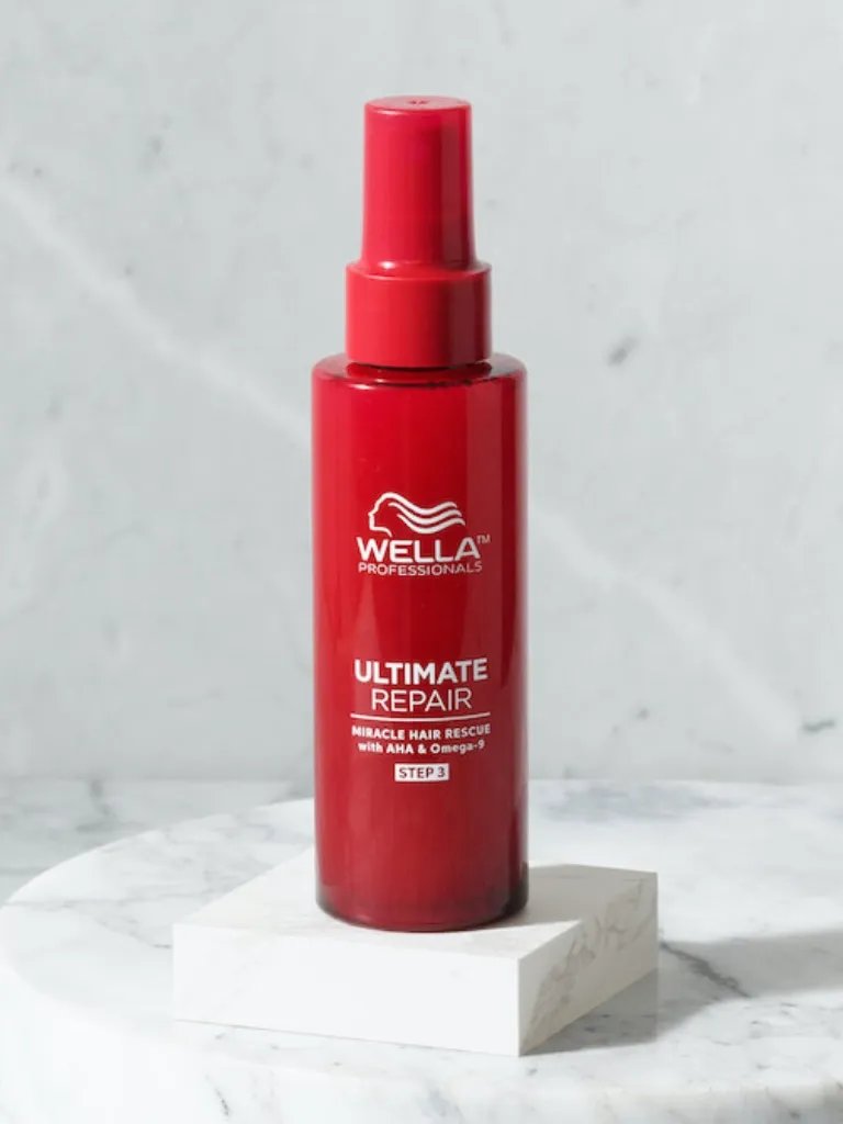 ULTIMATE REPAIR Miracle Hair Rescue on a marble surface.
