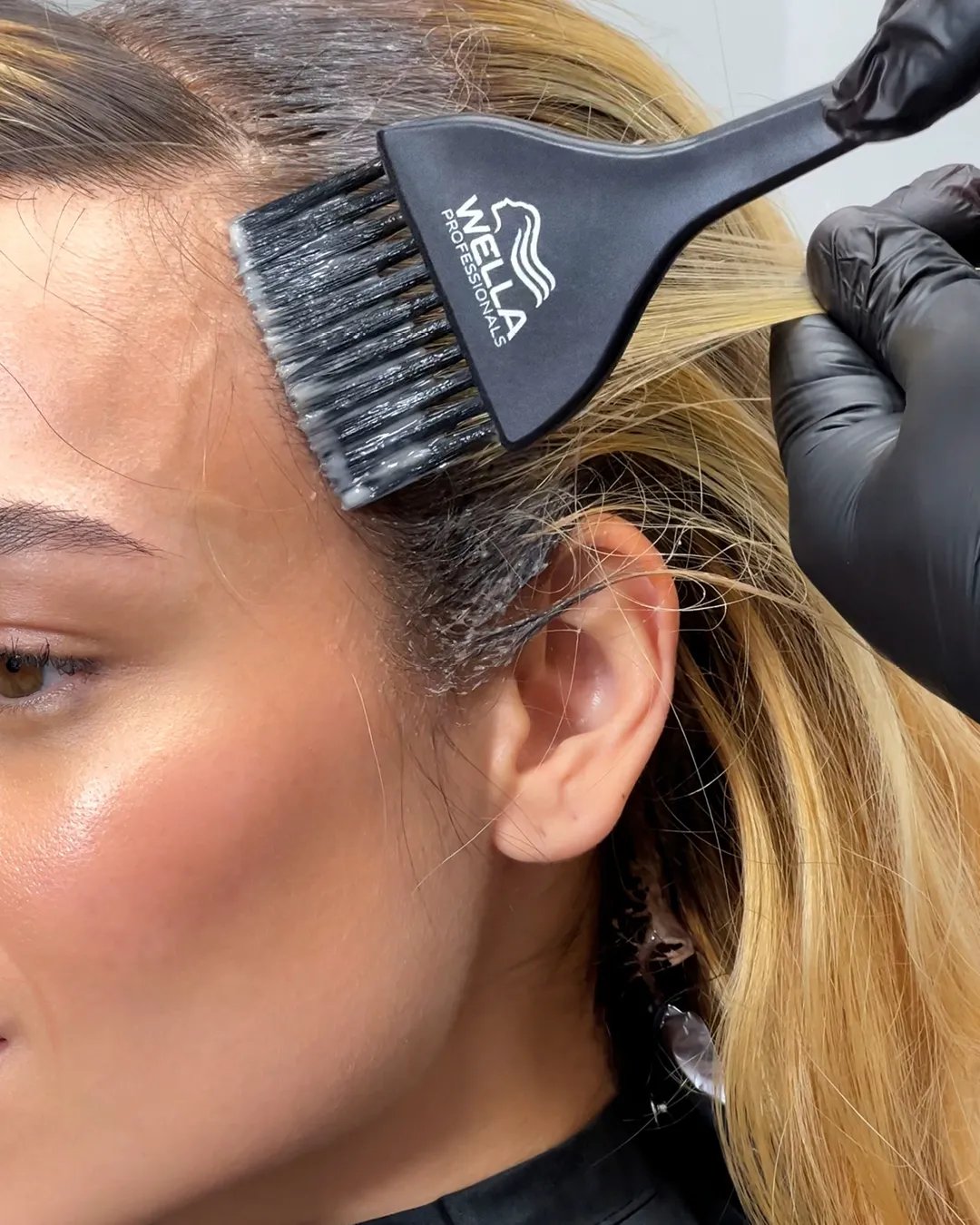 Wella Color Touch is applied to the roots of hair.