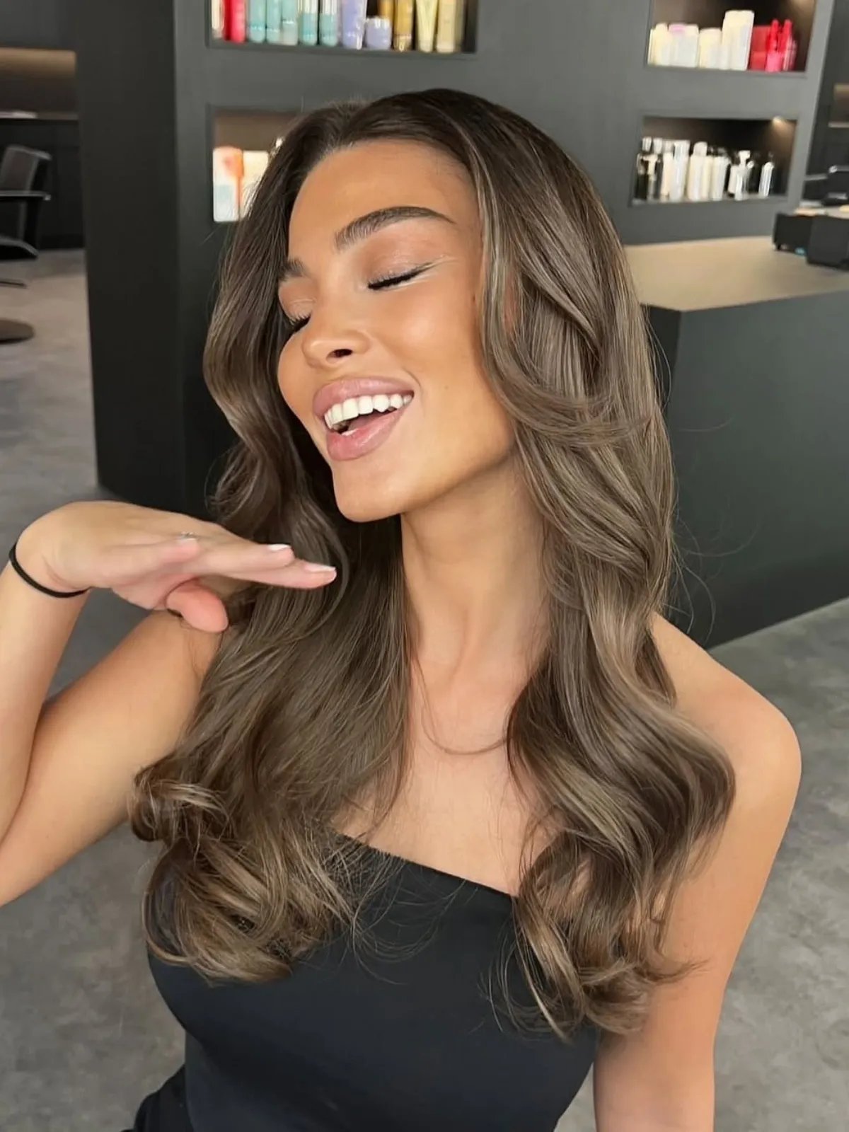 Ashy chocolate brown hair color with cool undertones and soft balayage highlights.