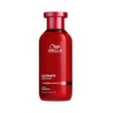 Eine rote Flasche Ultimate Repair Shampoo bei geschädigtem Haar von Wella Professionals