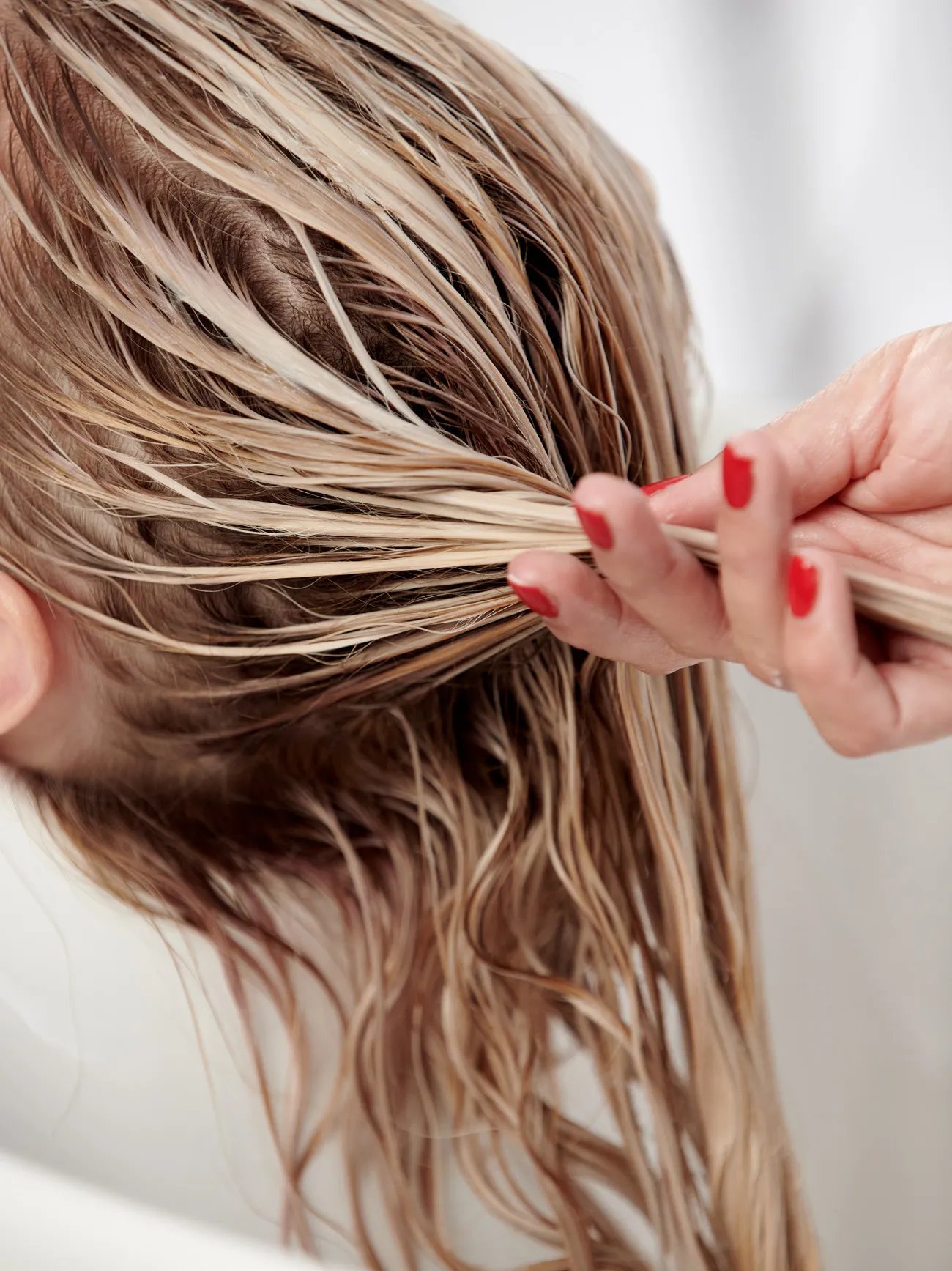 Model with long blonde wet hair
