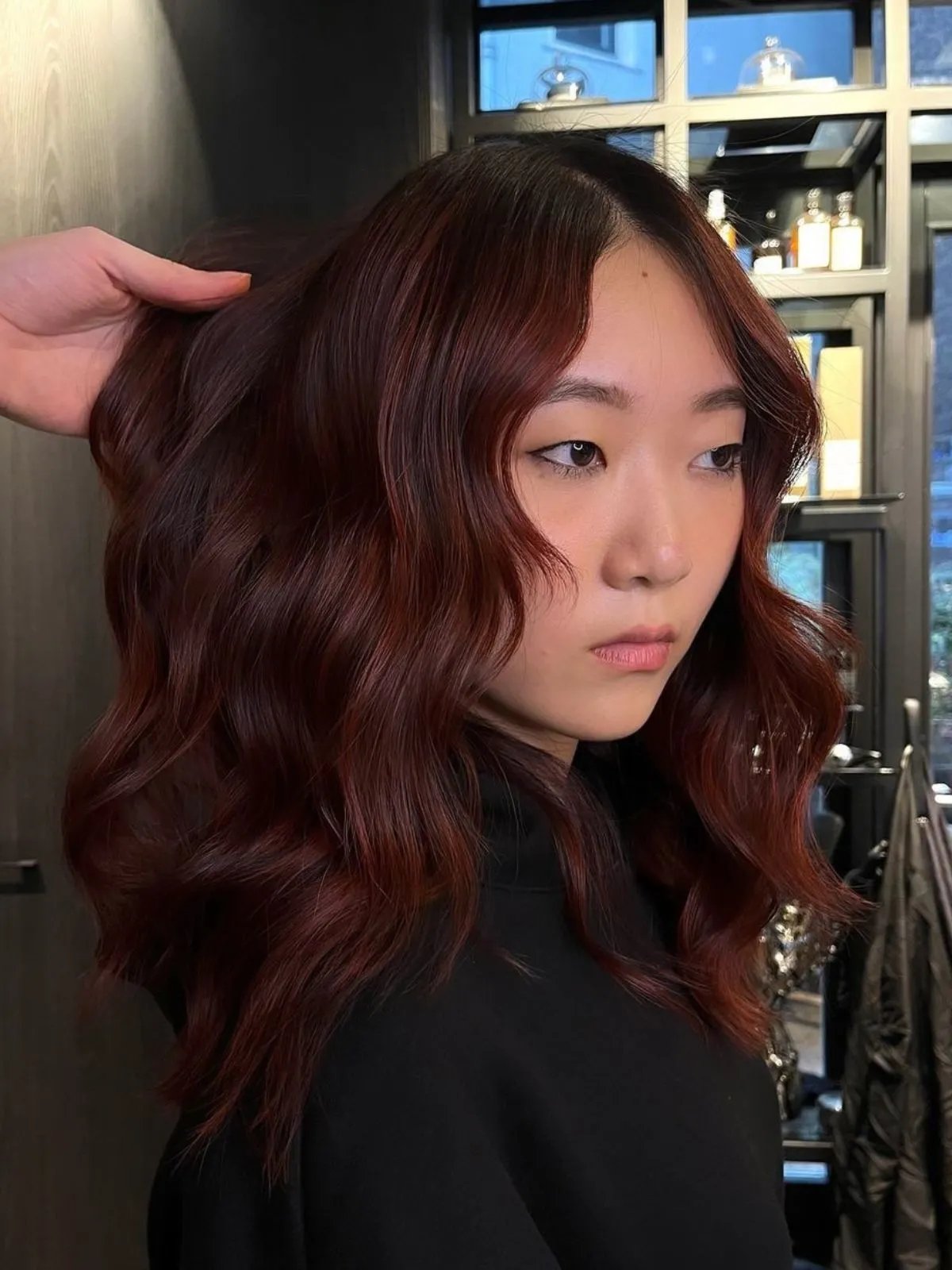 Model with deep mahogany coloured hair.