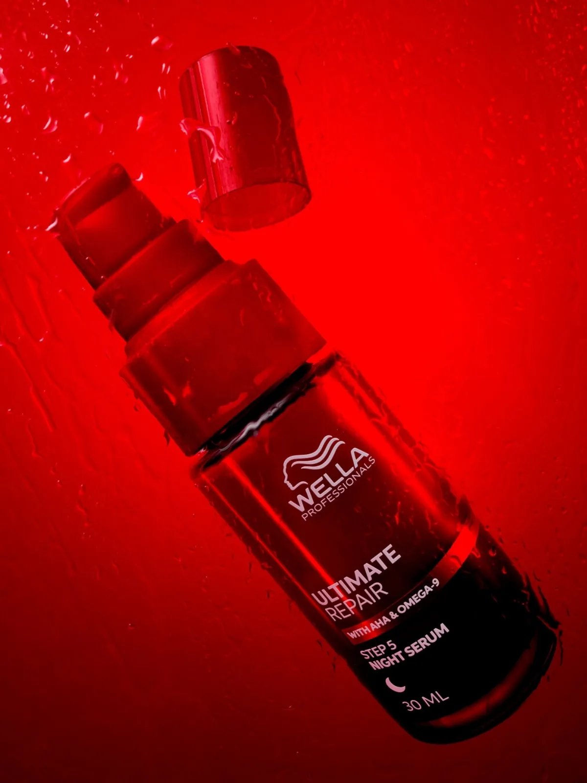 ULTIMATE REPAIR Night Serum on a red background.