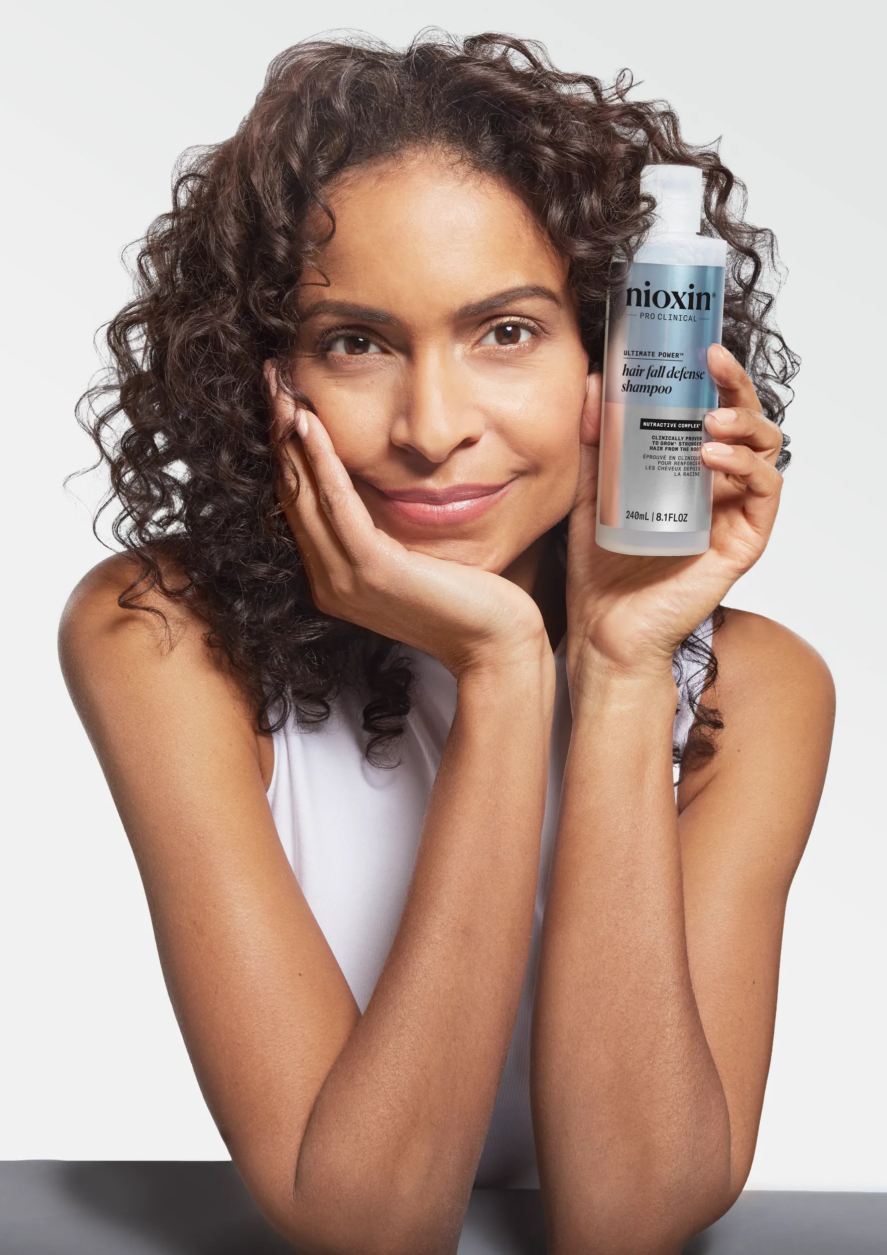 women holding shampoo