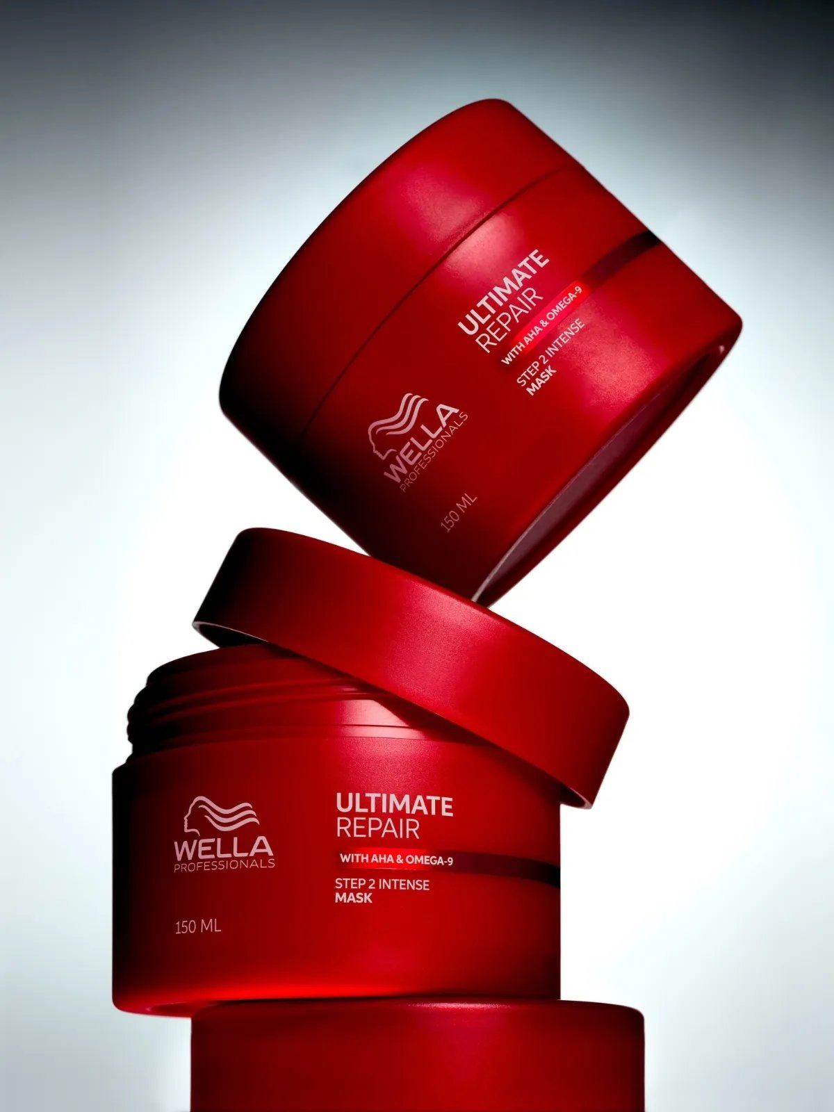 Jars of ULTIMATE REPAIR Mask stacked on top of one another.