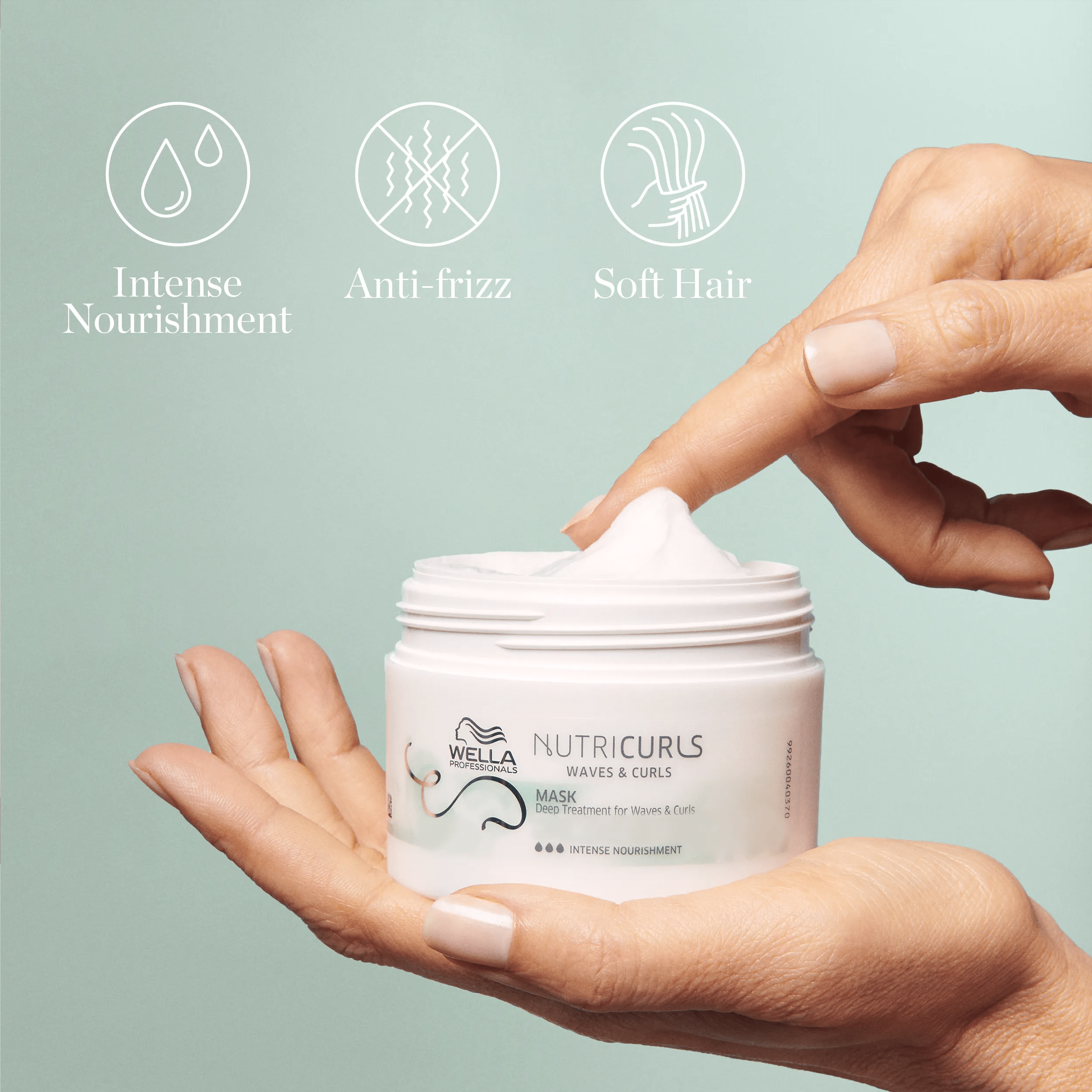 Hands holding a jar of Wella Professionals NutriCurls Waves & Curls Mask. Above the product are icons representing key benefits: Intense Nourishment, Anti-Frizz, and Soft Hair.