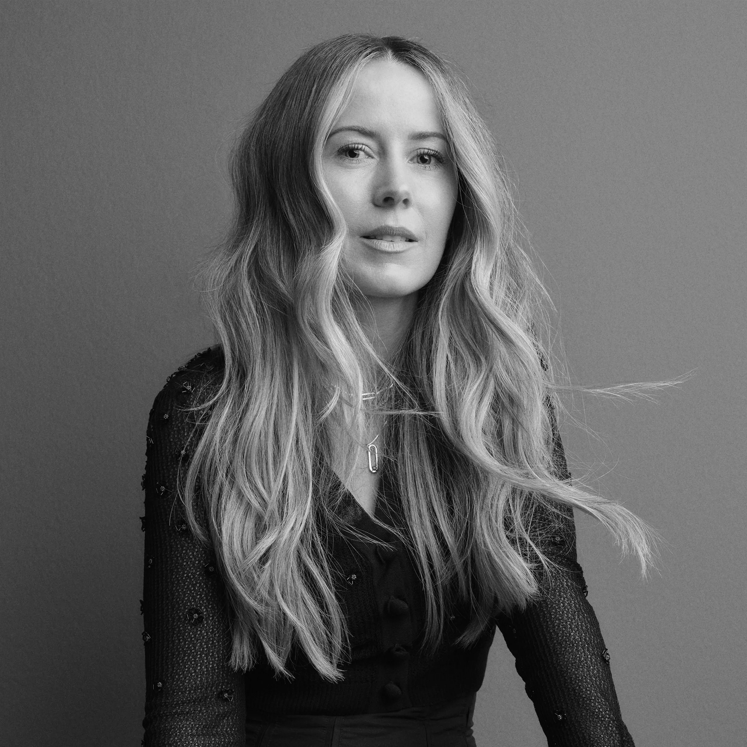 A black and white portrait of Nikki Lee