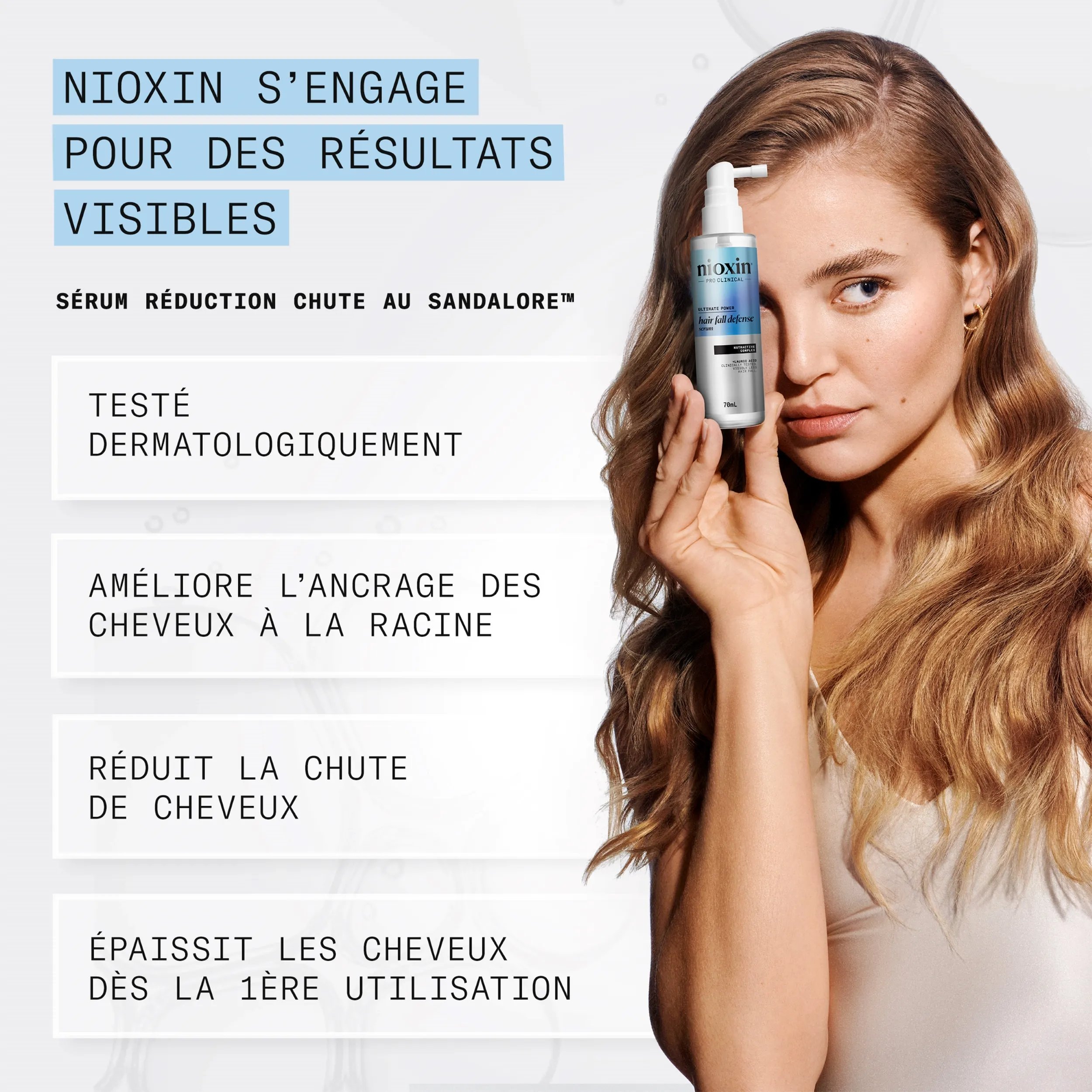 Femme blonde appliquant le sérum antichute au Sandalore™ de Nioxin sur son cuir chevelu