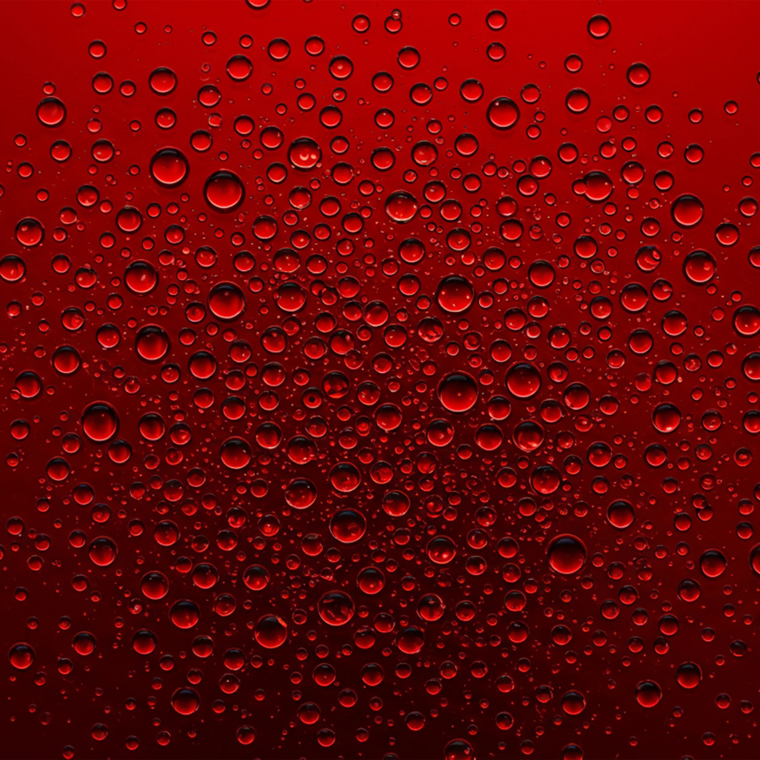Ultimate Repair Miracle Hair Rescue drops over a red surface
