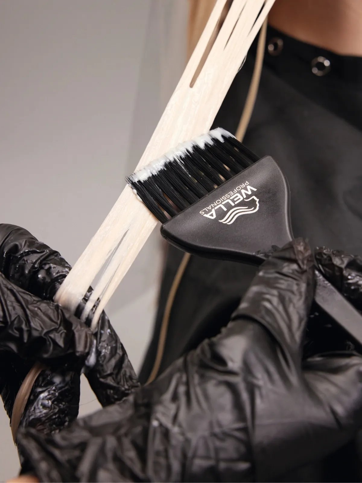 Model with long, loosely tousled, neutral blonde hair featuring beautifully blended highlights.