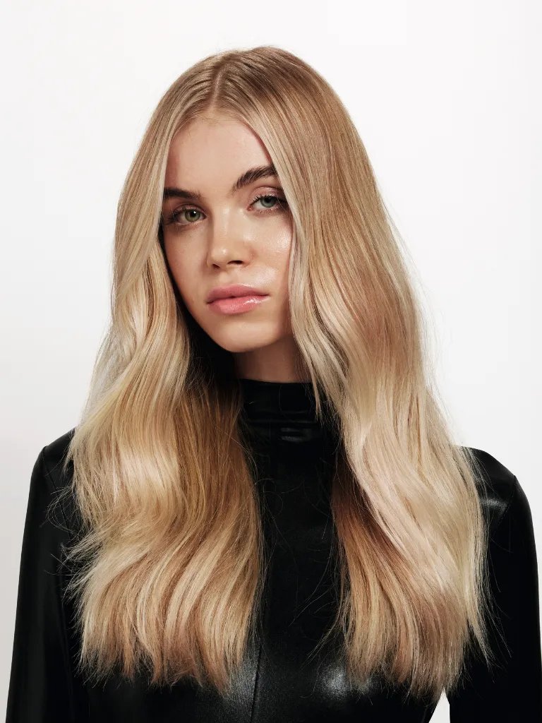 Model with long, loosely tousled, golden blonde hair.