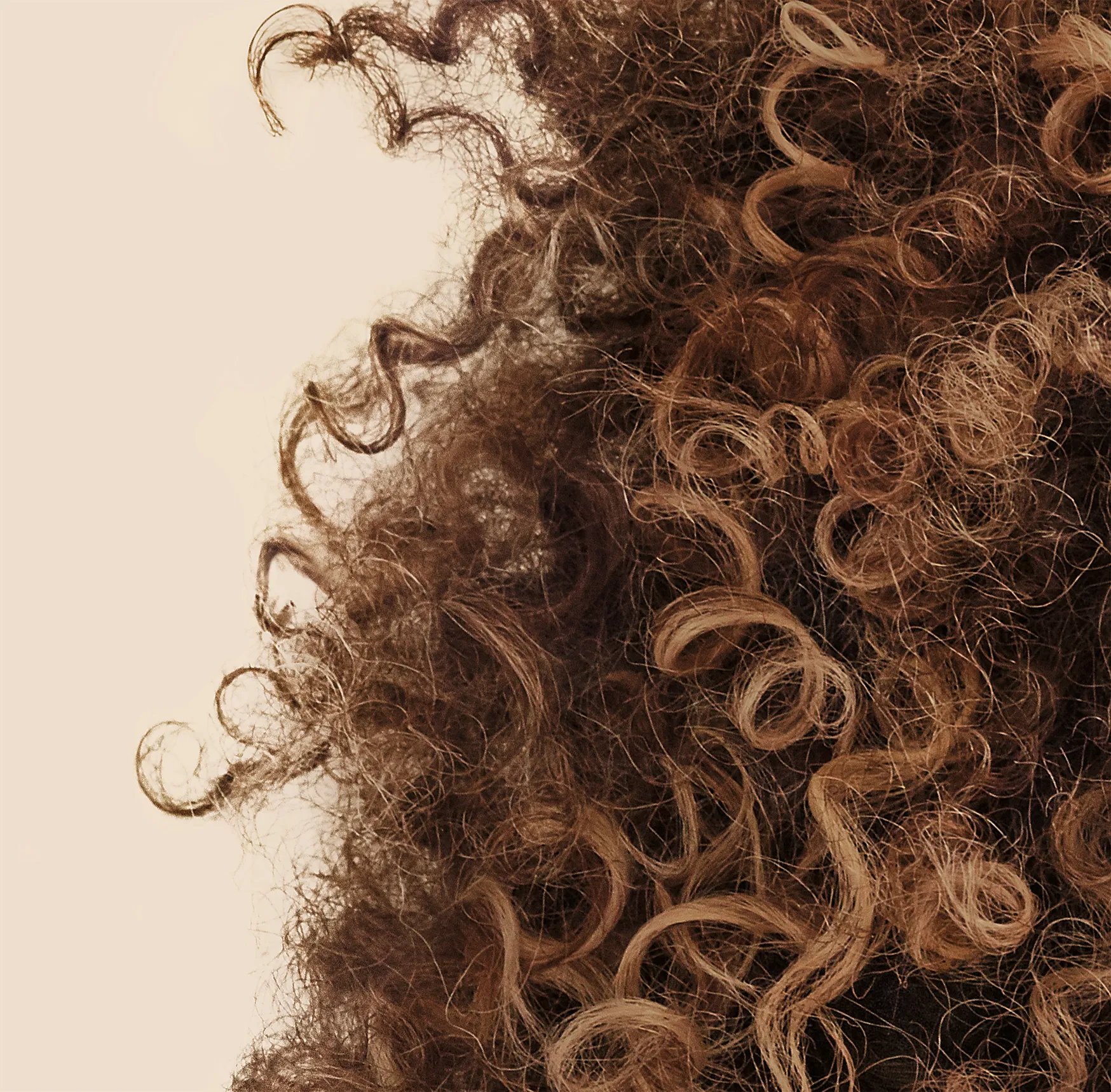 Curly, brown hair 