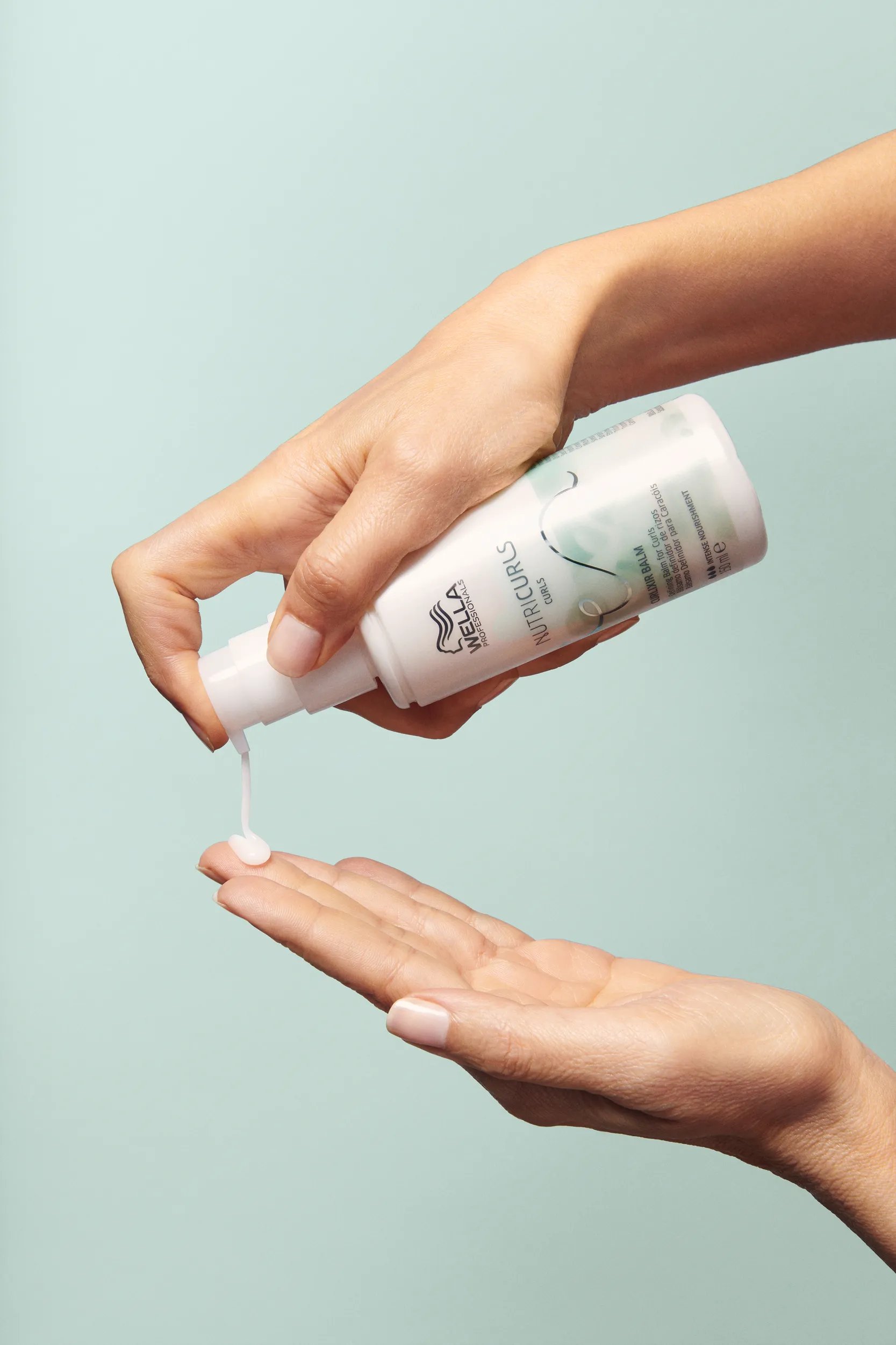 Hand holding Nutricurls Balm