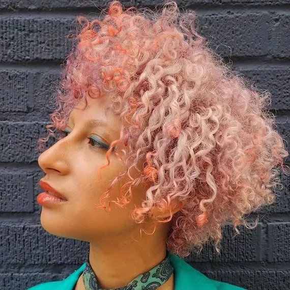 Model with curly pink hair 