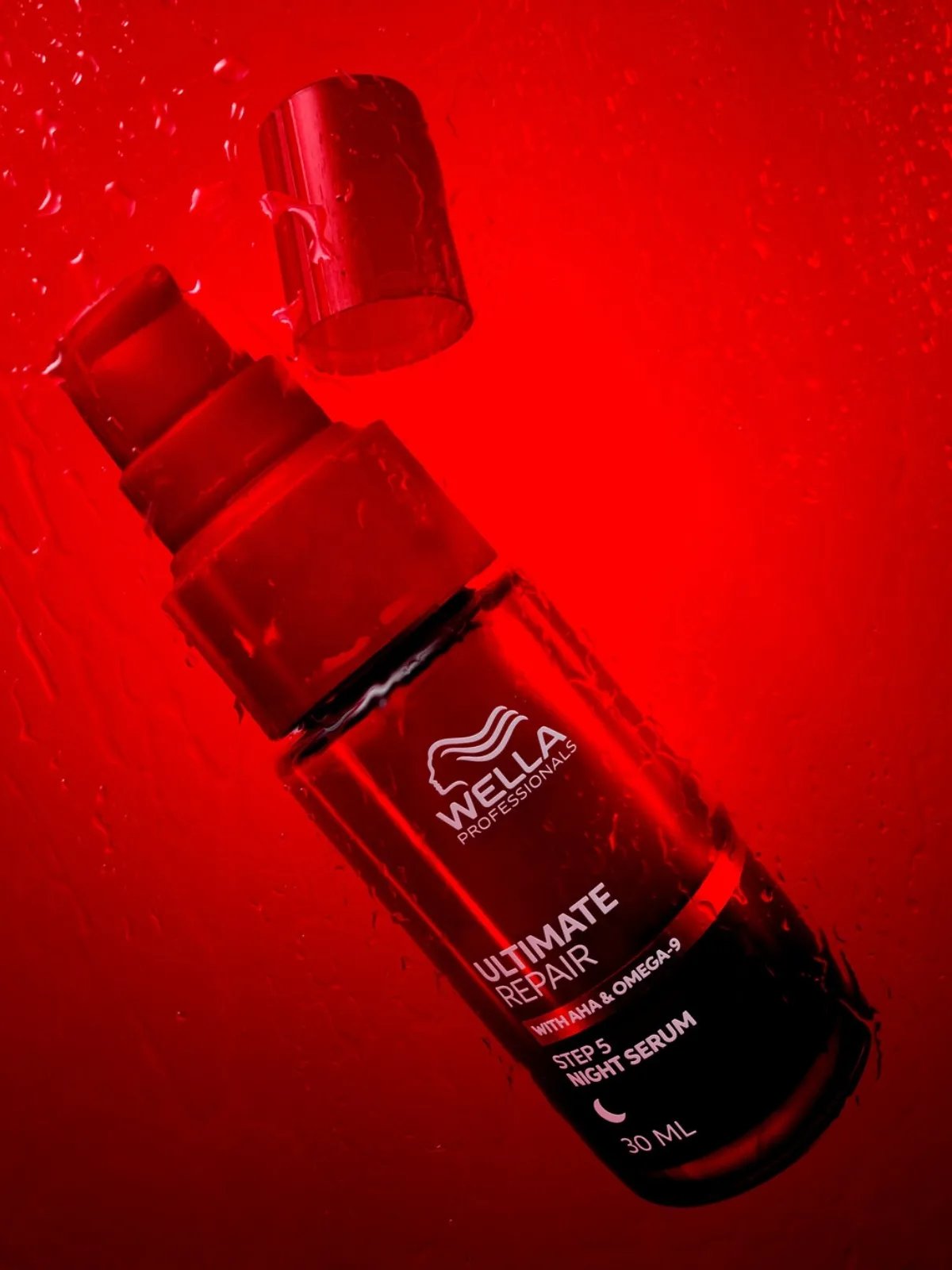 ULTIMATE REPAIR Night Serum on a red background.