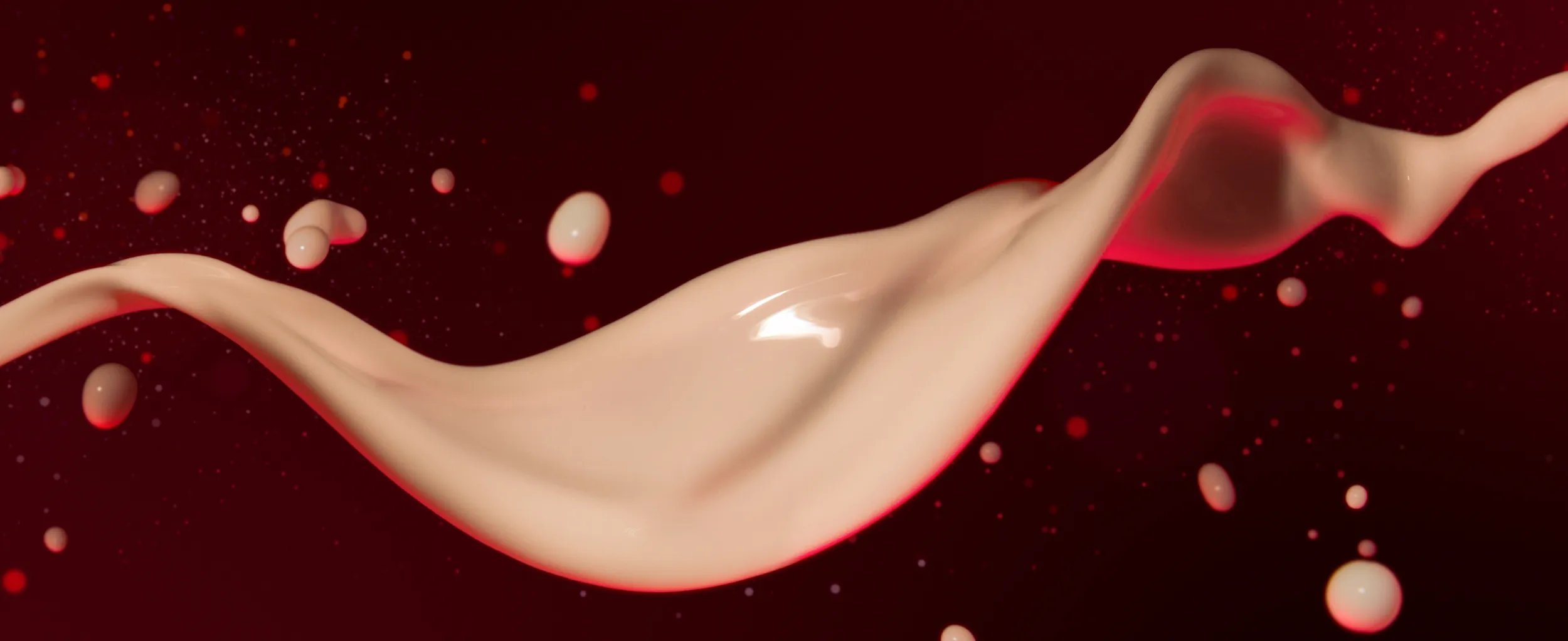 Close up of white droplets against red background.