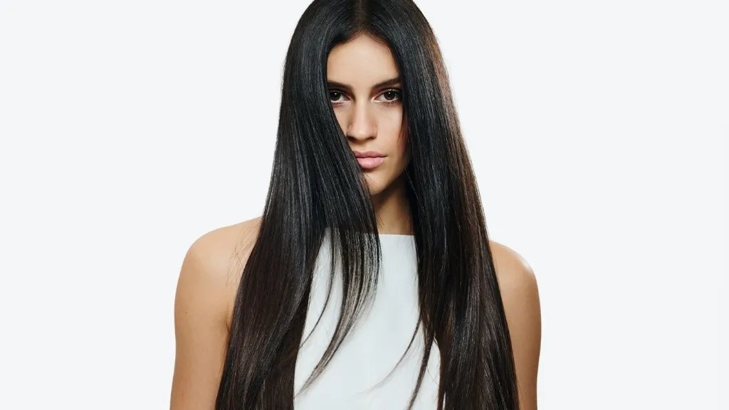 Model with long, straight, dark brown hair.