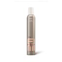 Wella EIMI Extra Volume volumizing mousse packshot - a pewter bottle with a white lid and pink EIMI logo.