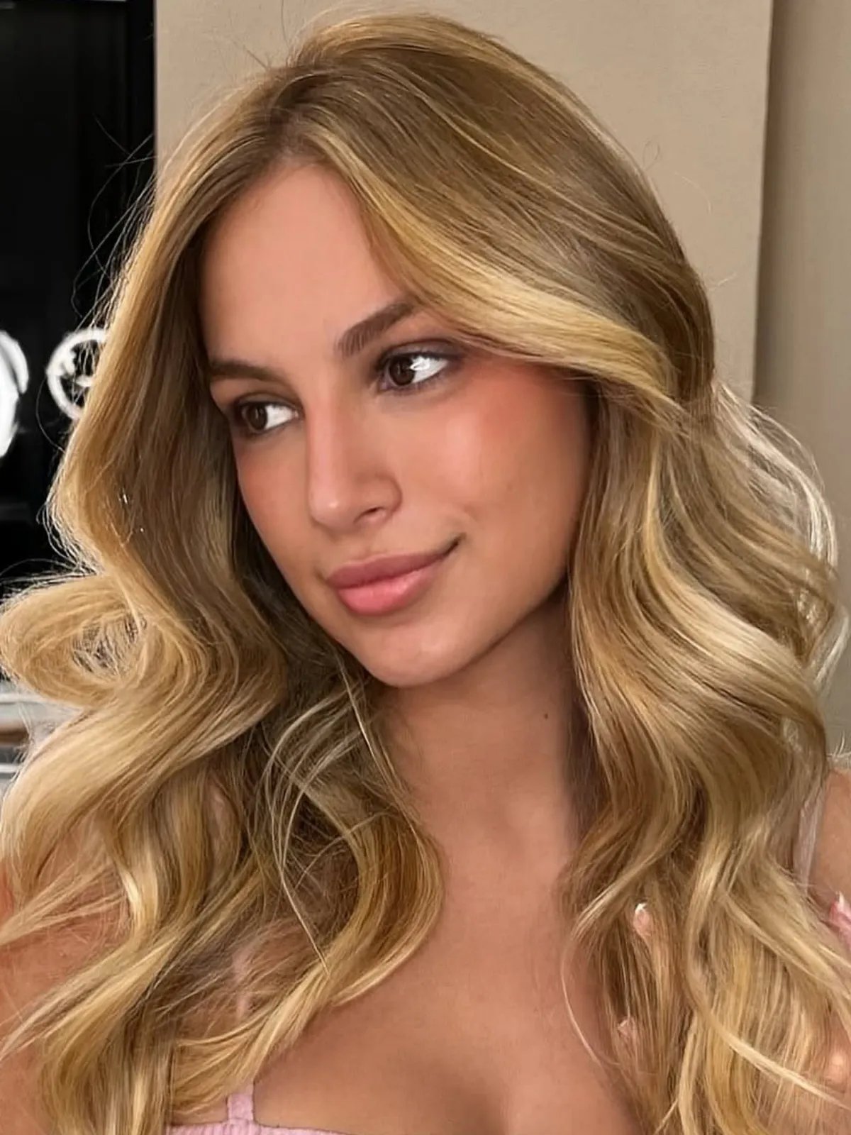 Honey blonde waves with soft dimension.