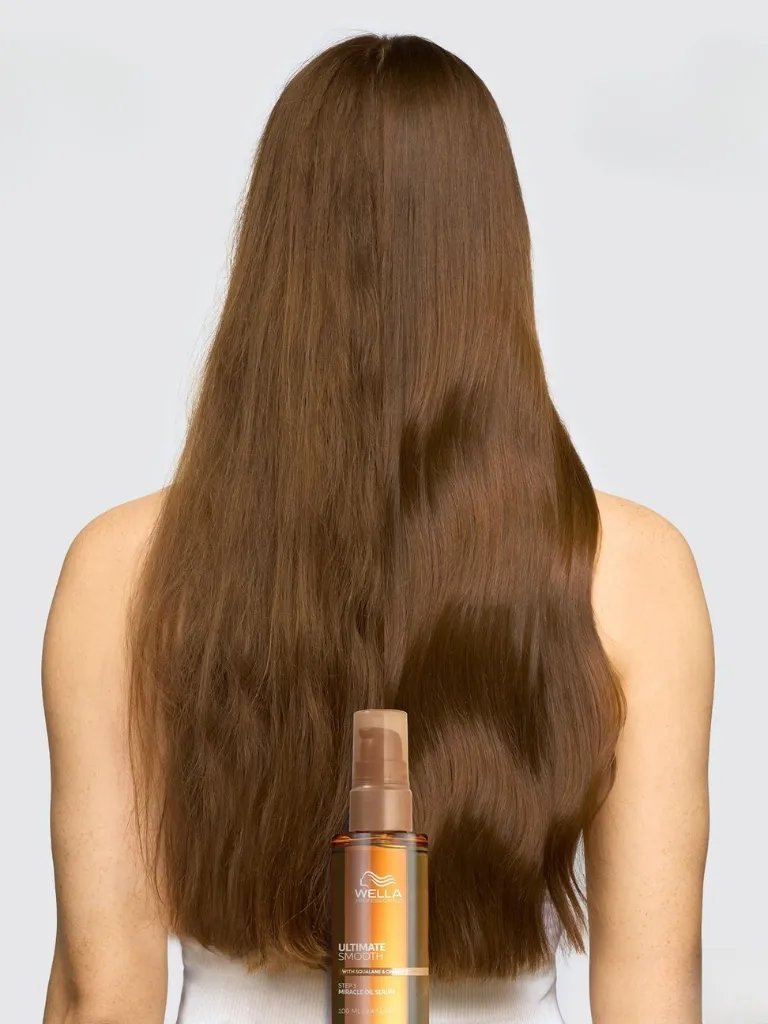 Before and after showing model’s long, brown hair look smoother and glossier after using ULTIMATE SMOOTH.