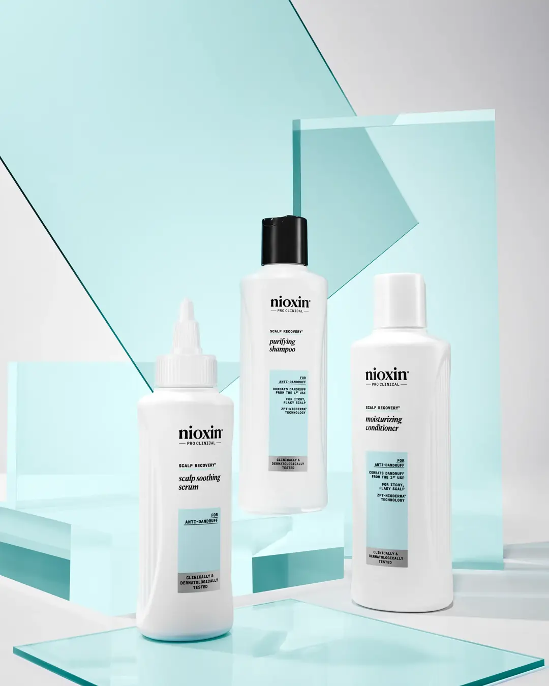 Nioxin scalp recovery range bottles against blue and white background