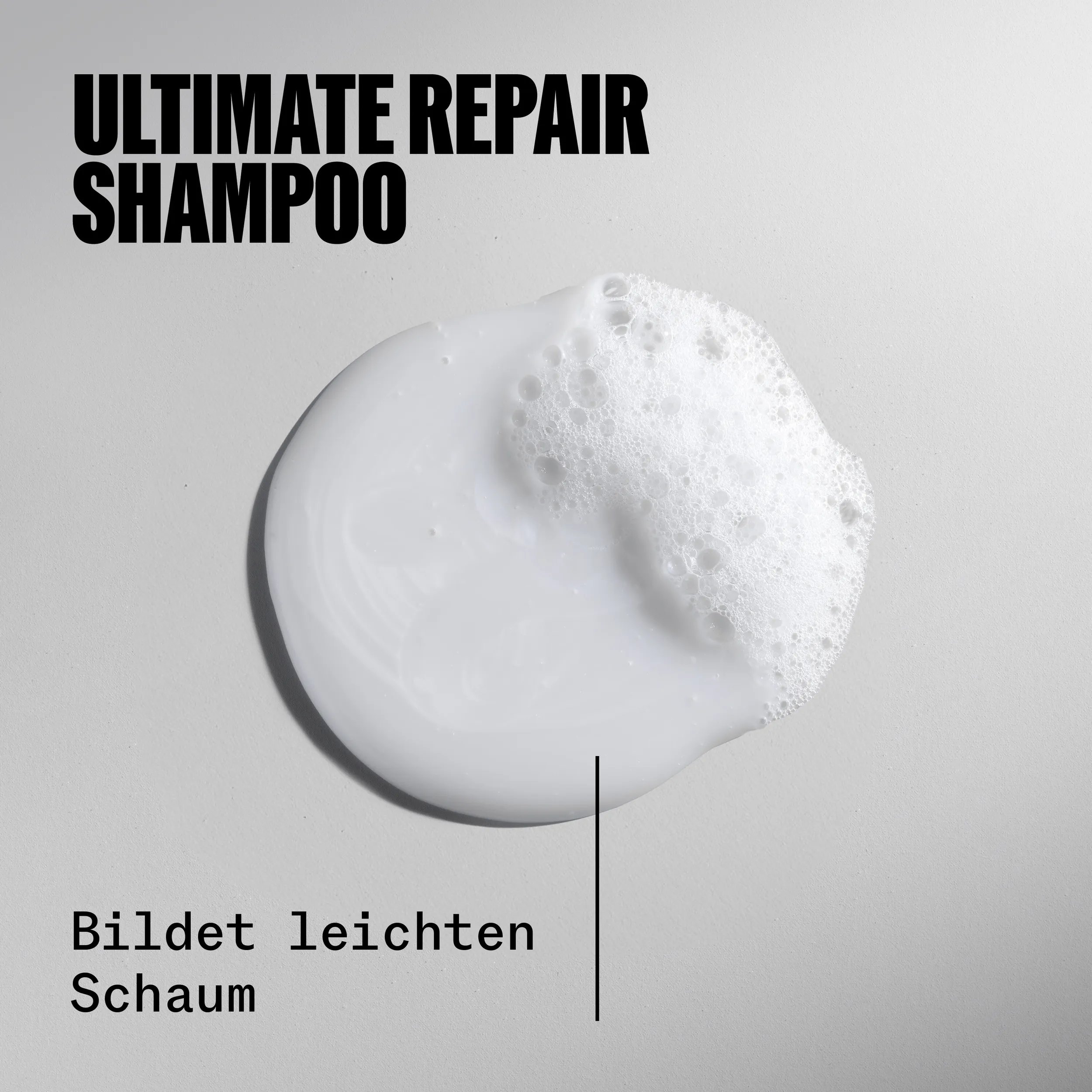 Drop of Ultimate Repair Shampoo. Text reads lathers into a lightweight foam.