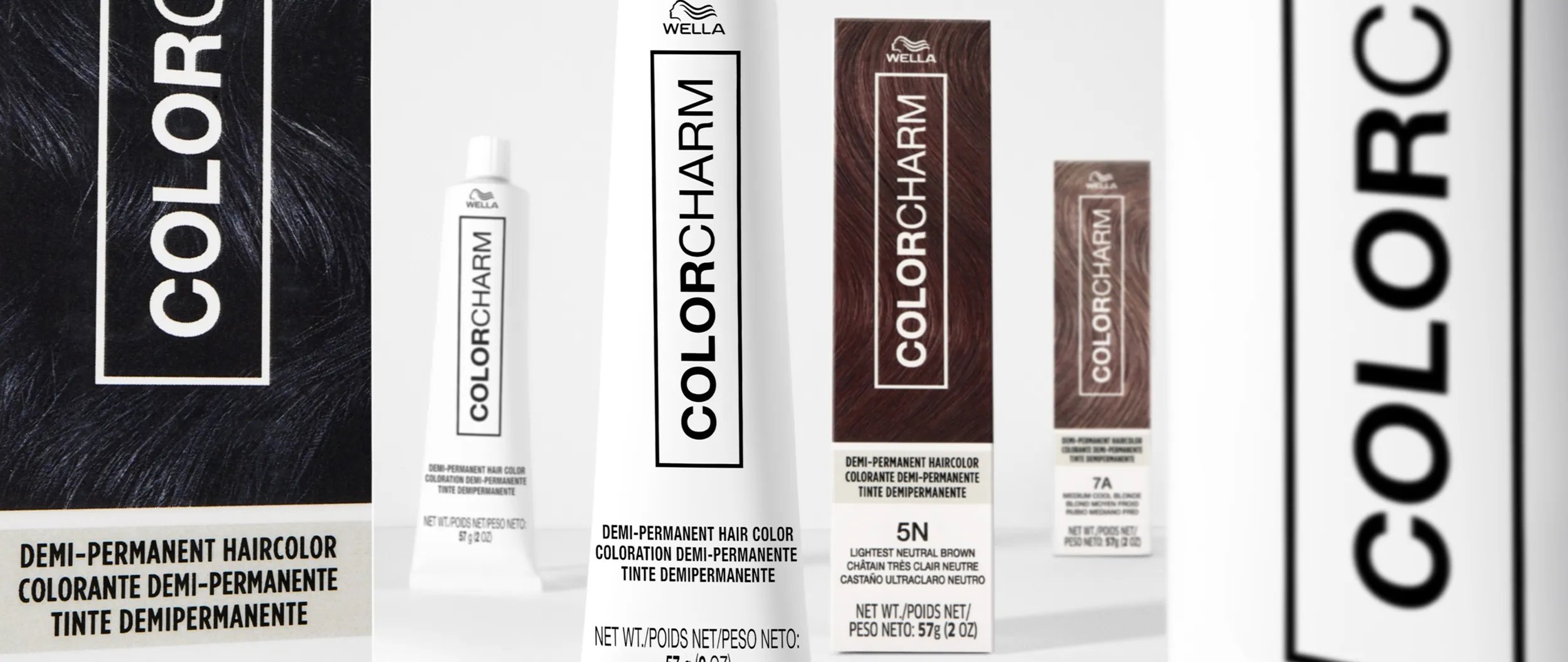 Image of multiple Color Charm demi-permanent and permanent hair color boxes and tubes in various shades.