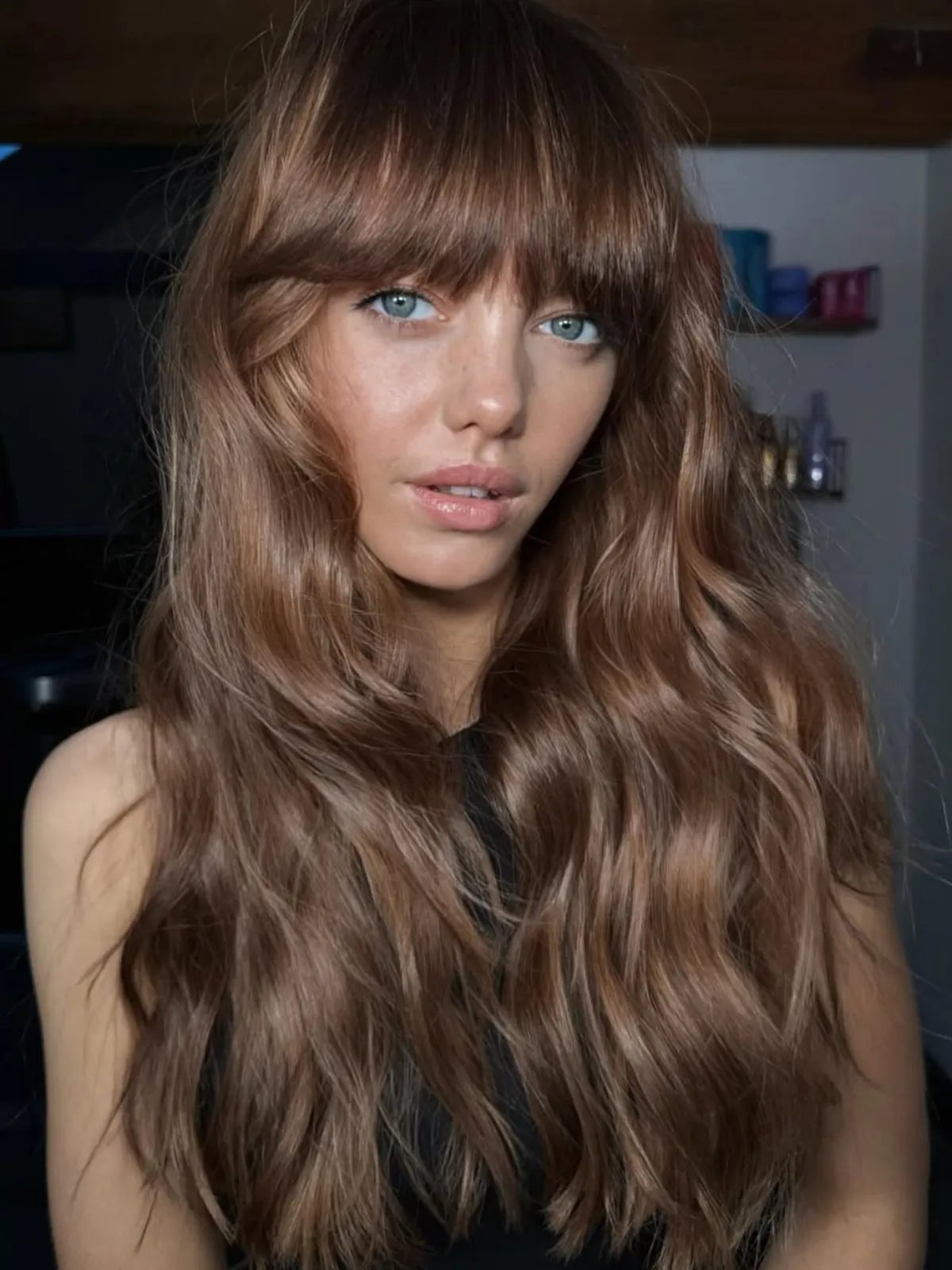 All-over medium chocolate brown hair with glossy shine.