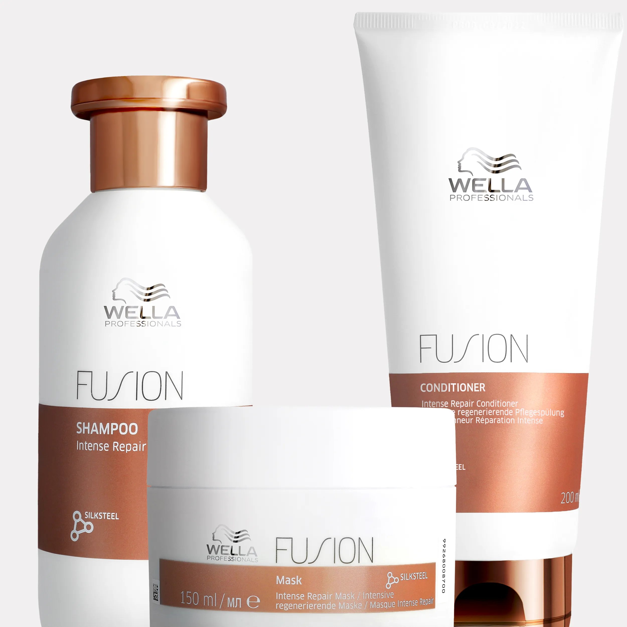 Wella Fusion Intense Repair shampoo, conditioner, and mask product shot.