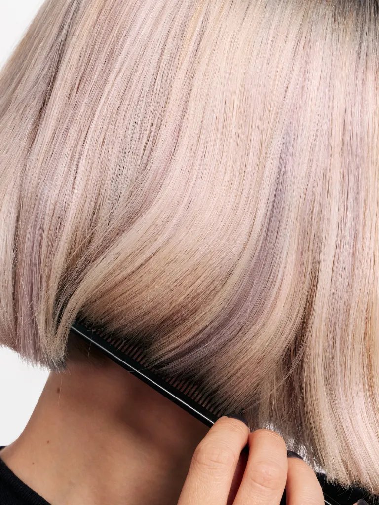 Close-up of model’s platinum blonde highlights.