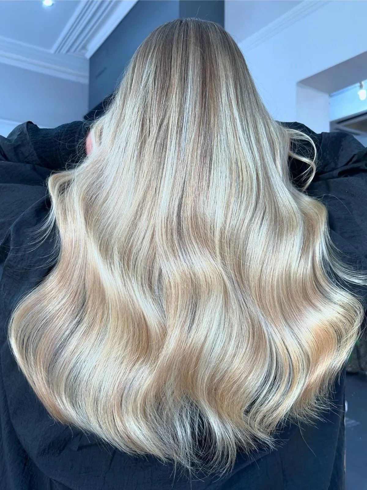 Model with long, loosely tousled, butter blonde hair.