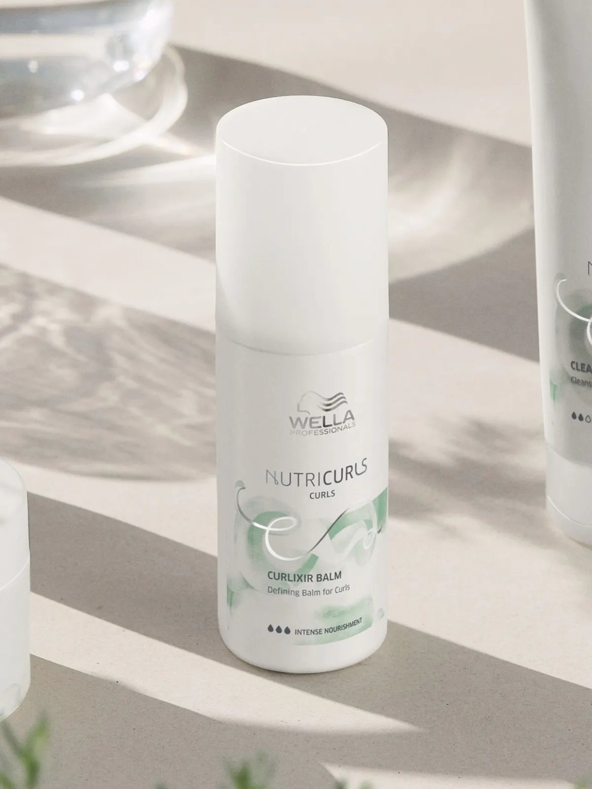 NutriCurls Curlixir Balm on a white surface.