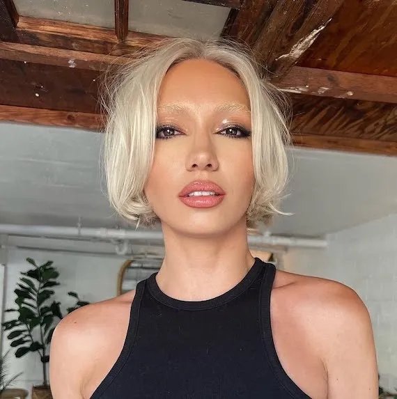 Model with jaw-skimming, platinum blonde, layered bob.
