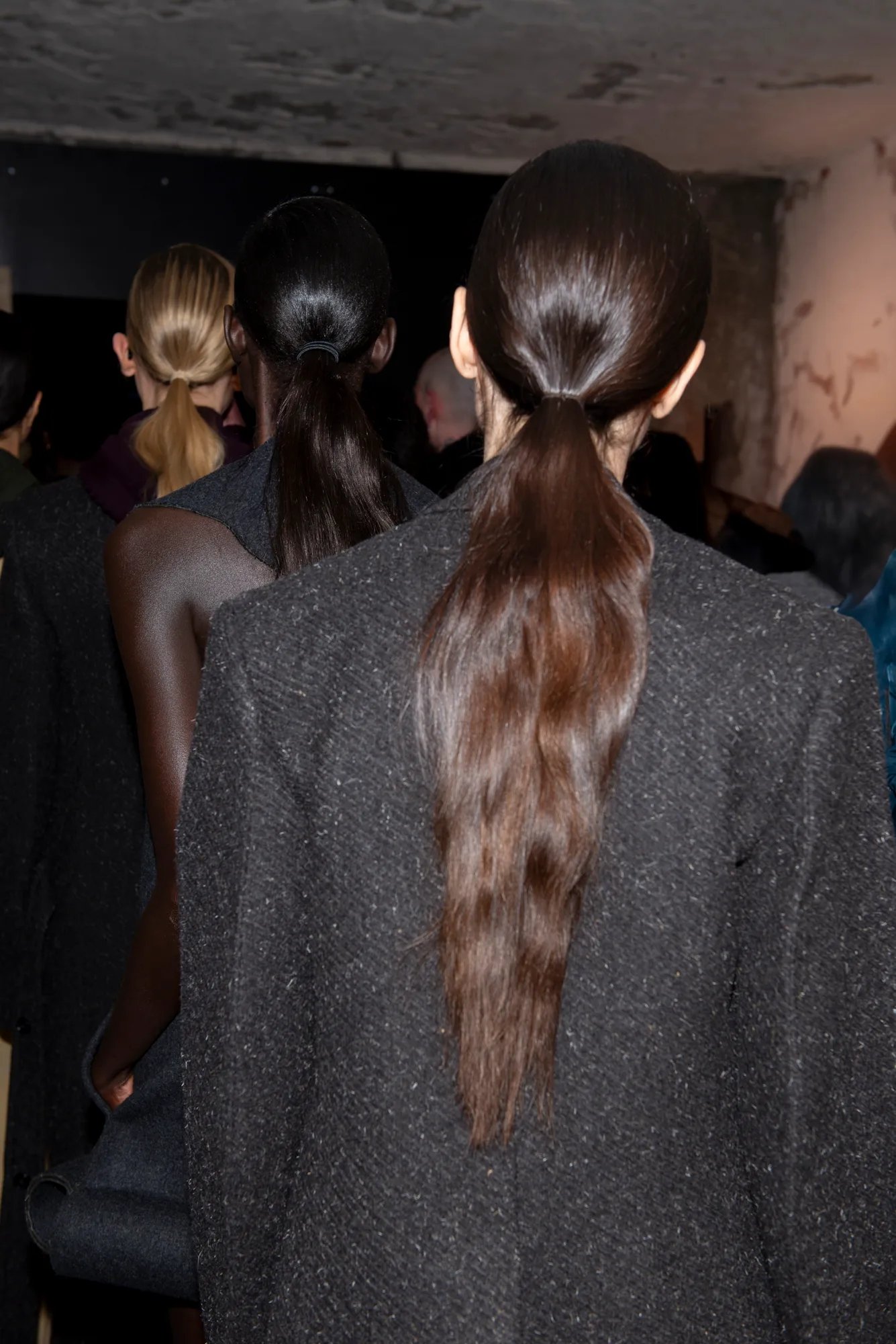 Models prepare to walk the runway at Victoria Beckham’s FW25 show.